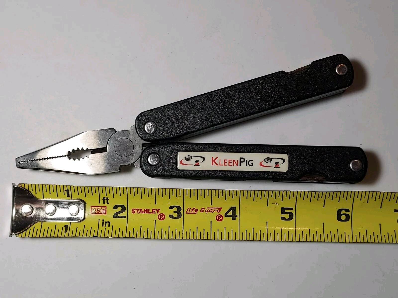 Barlow Multi Tool advertising Kleen Pig with sheath