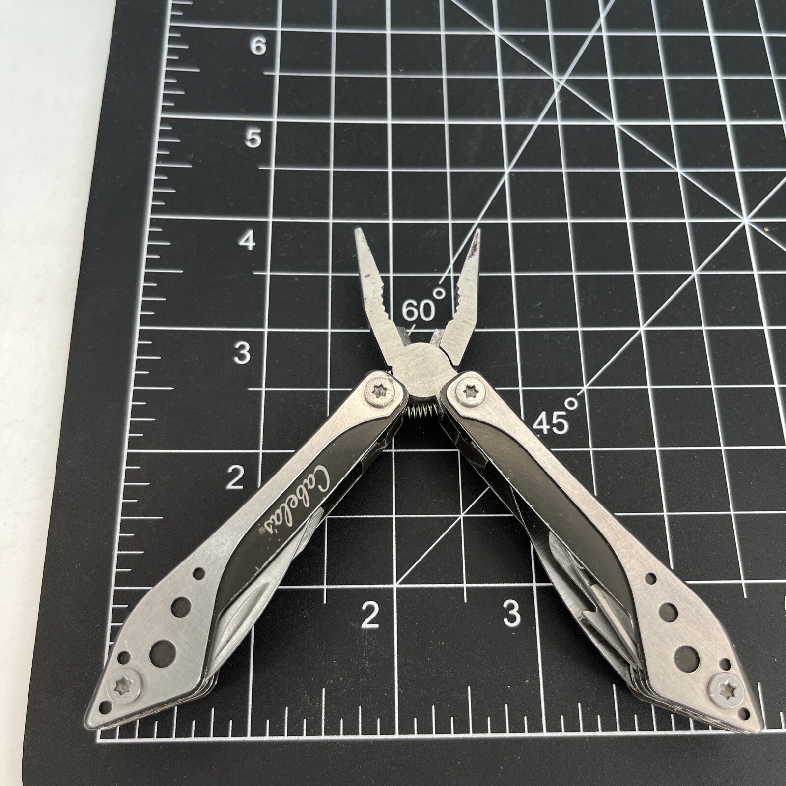 LOT OF 2 Cabela’s PURPLE & SILVER Mini MultiTool Spring Open Pliers Scissors Saw
