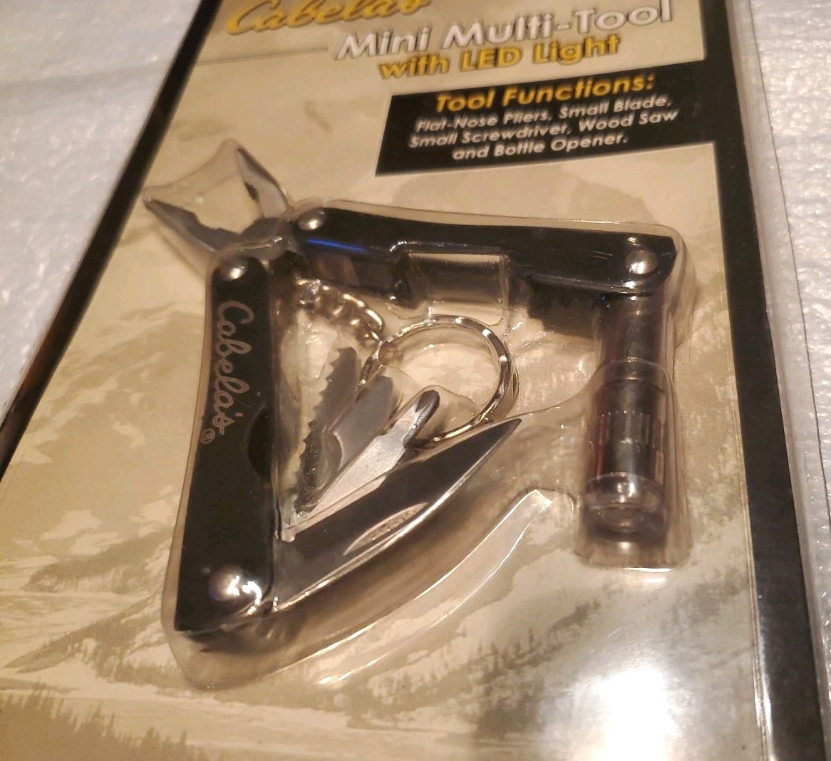 Cabela’s Mini Multi-Tool- Pliers, Saw, LED Light & Nylon Pouch #50018072 Black