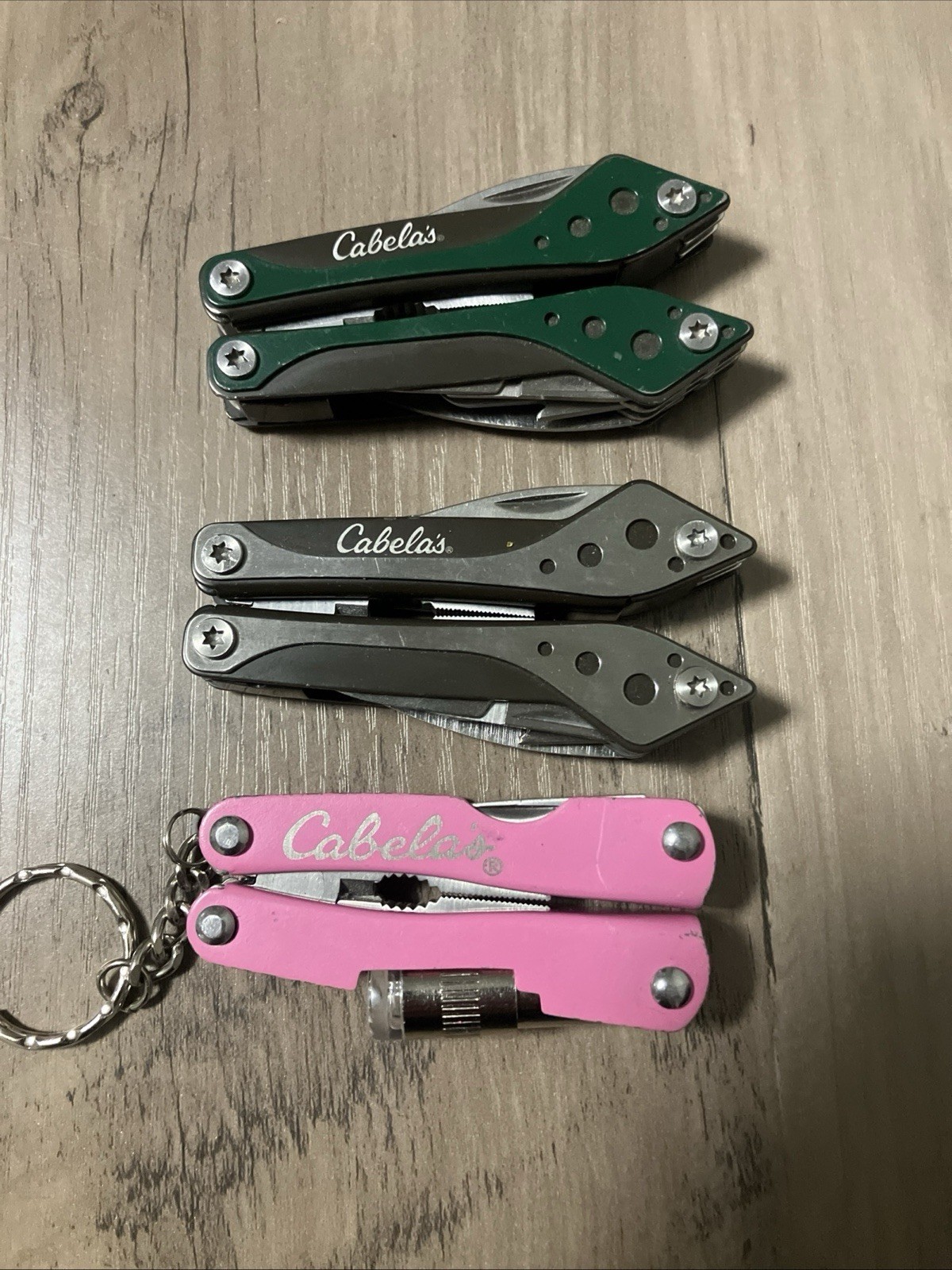 Lot Of 3 Cabela’s Green, Silver And Pink Mini Multi-Tools Spring Asst