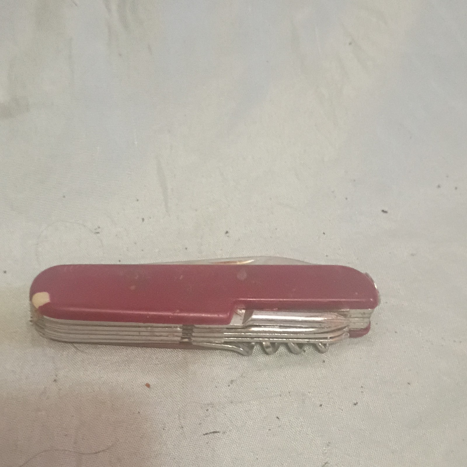 Stainless Steel Multi-Tool 10 Tools Knife Scissors Saw Corkscrew Can Opener Red