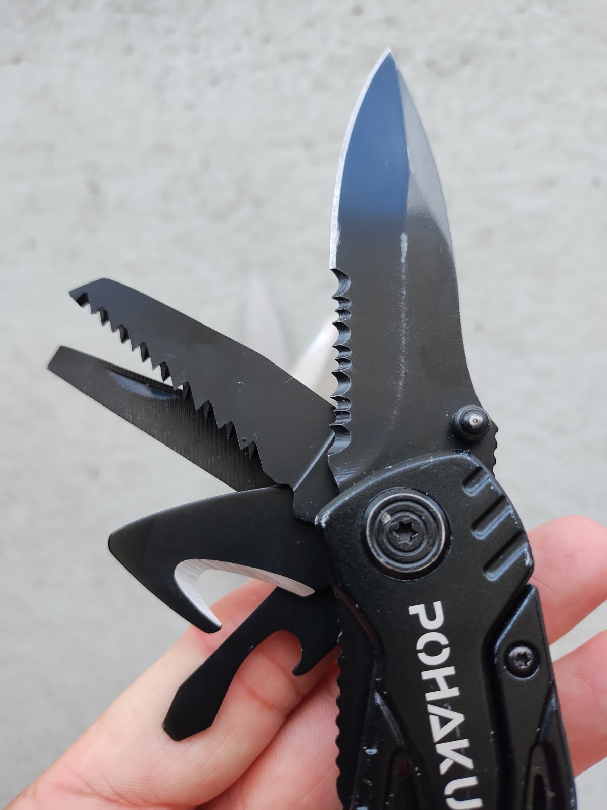POHAKU BLACK & SILVER MULTI TOOL PLIERS KNIFE, SAW BLADE, FILE, ETC. LOT OF 2