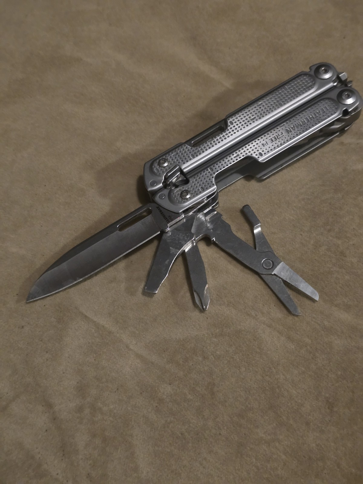 Retired Leatherman Free P4 Multi-Tool With Sheath and Donk Titanium Pocket Clip