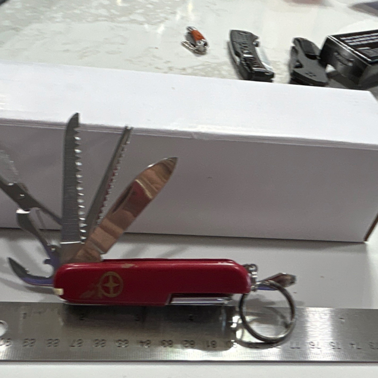 Red Multi-Tool with 7 Implements, Stainless Steel Blades, Key Ring Included