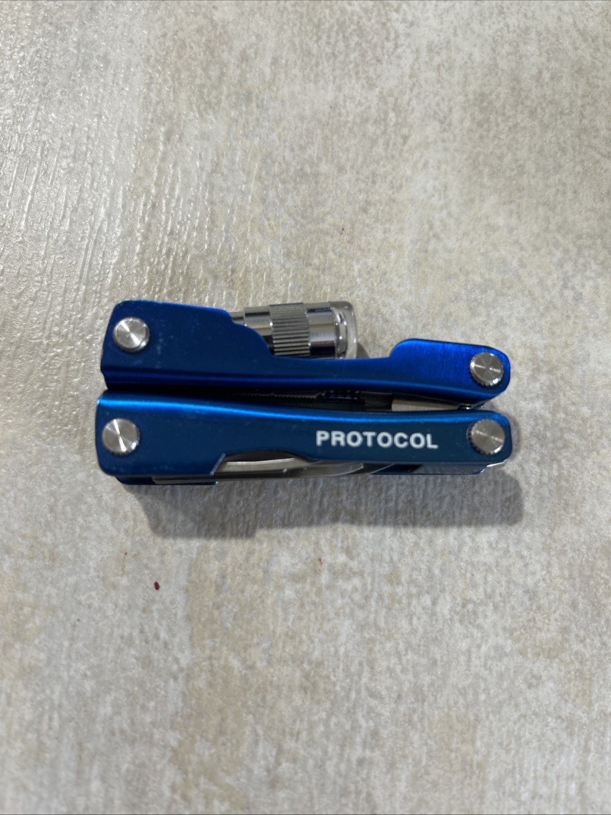 PROTOCOL 8 FUNCTION MINI MULTI TOOL WITH SHEATH – Pliers, Flashlight, Etc.