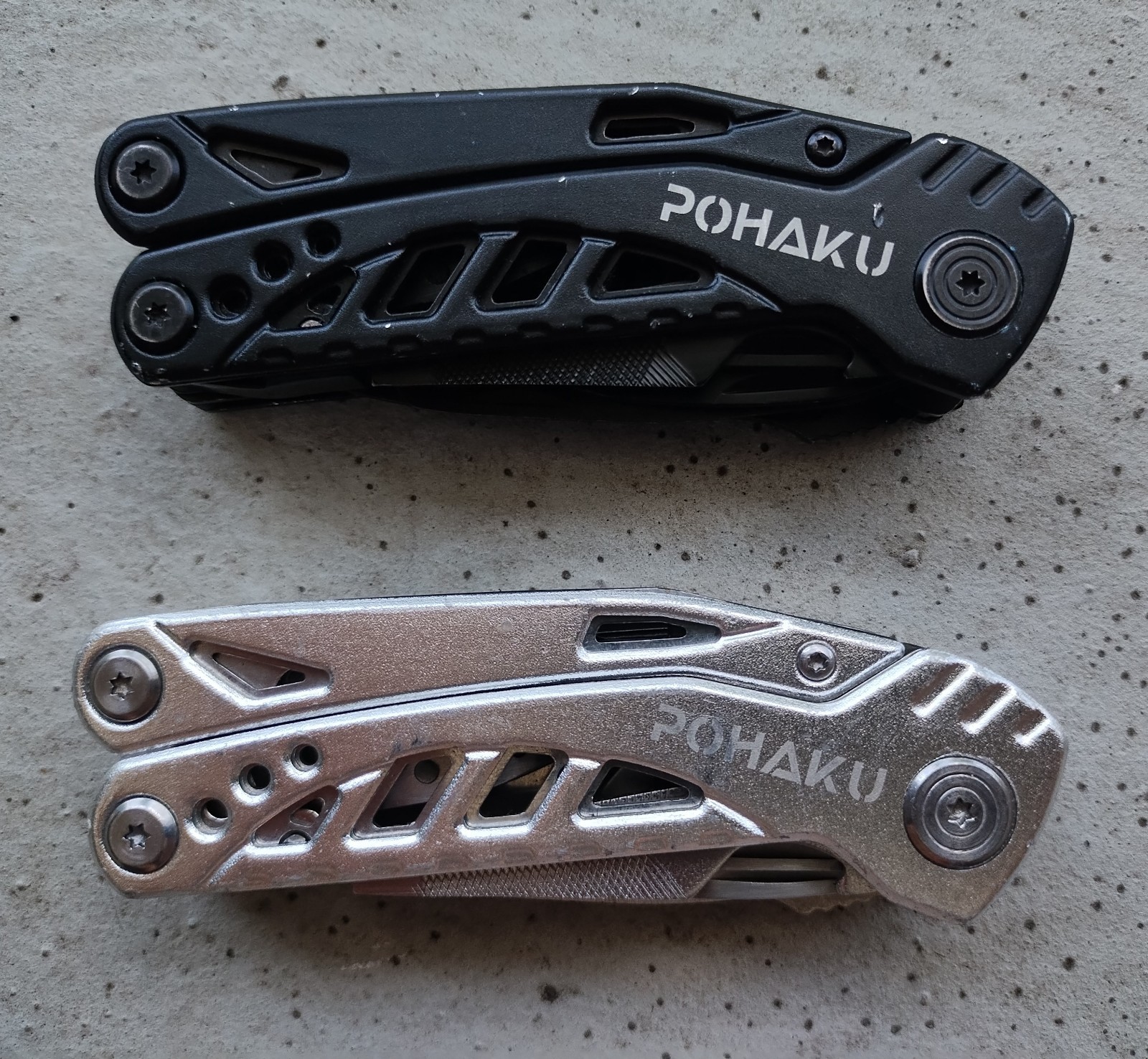 POHAKU BLACK & SILVER MULTI TOOL PLIERS KNIFE, SAW BLADE, FILE, ETC. LOT OF 2