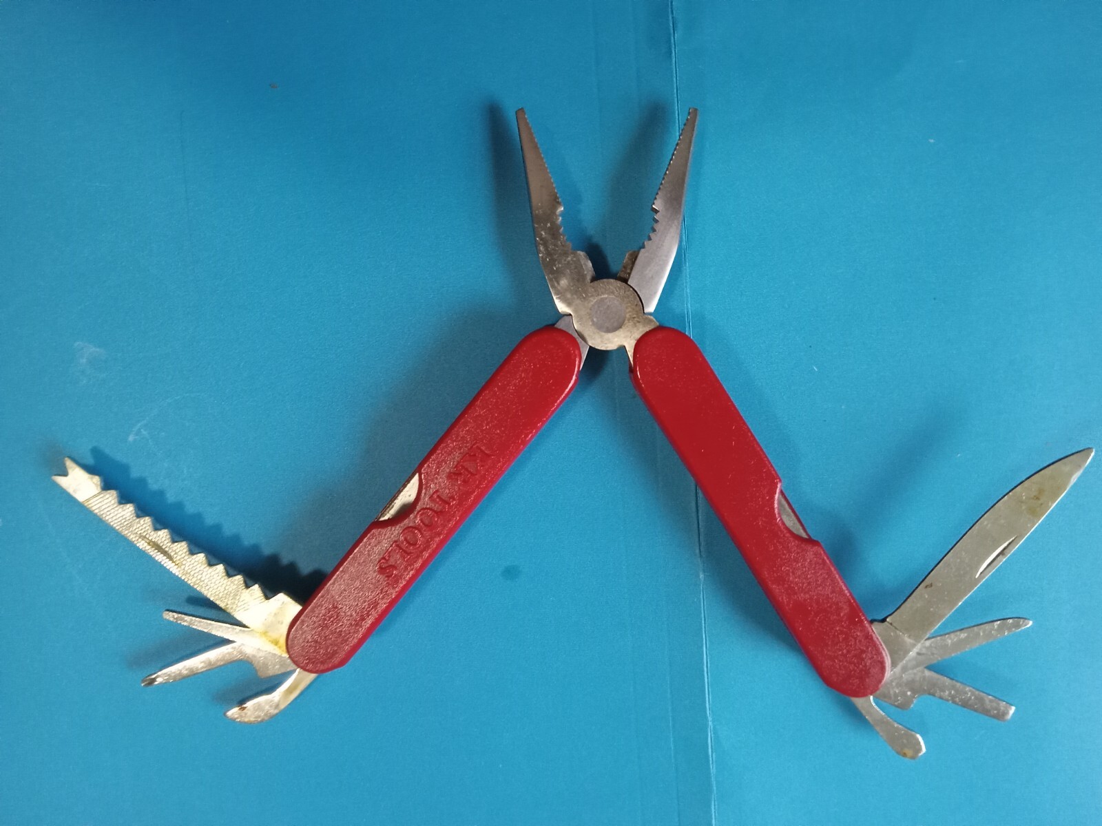 SK Tools 9 Multi Tool, no scrtches. Red in color. excellent condition