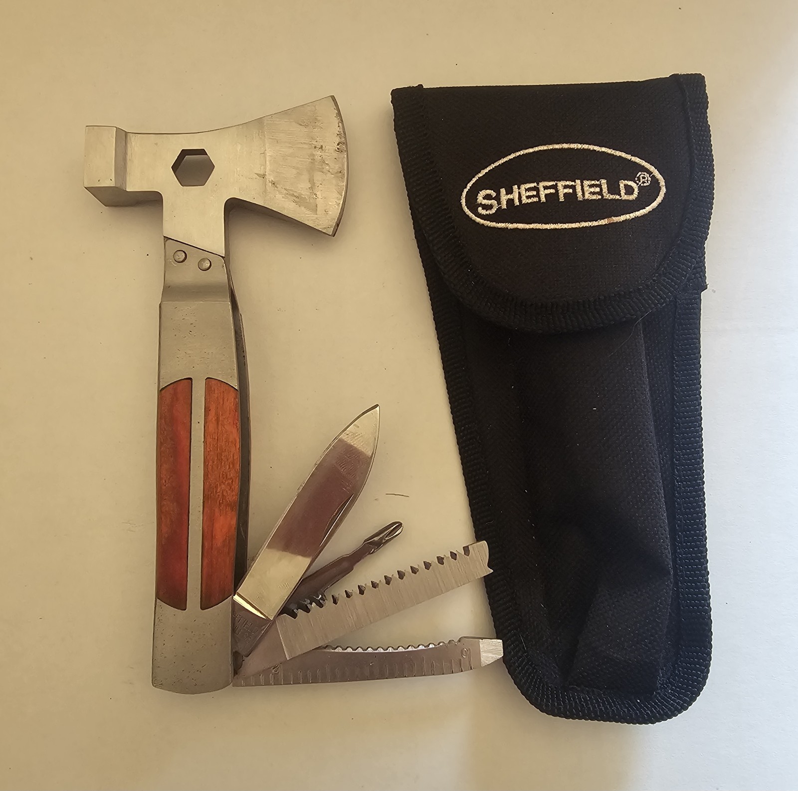 Sheffield 12301 Camper 12-in-1 Multi-Tool featuring a dual axe head and…