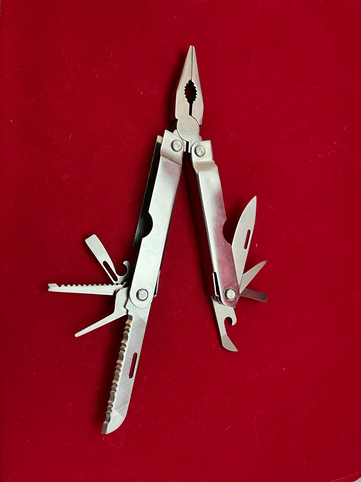 Stainless Steel 12-in-1 Multi-Tool – Pliers Knives Screwdrivers File Saw Opener