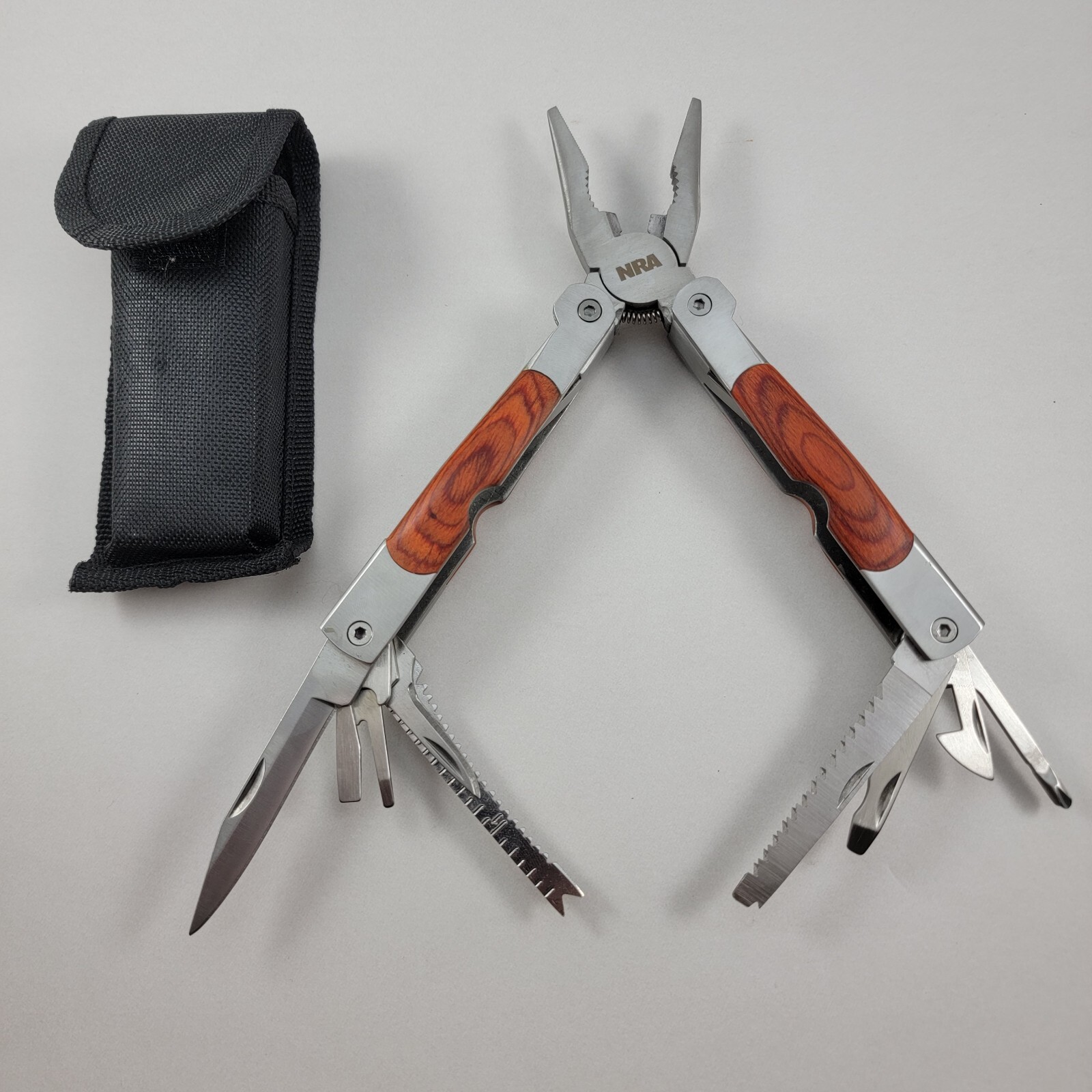 NRA Multi Tool – 4.5″ With Sheaf – Pliers, Knife, Can Opener & More – CLEAN