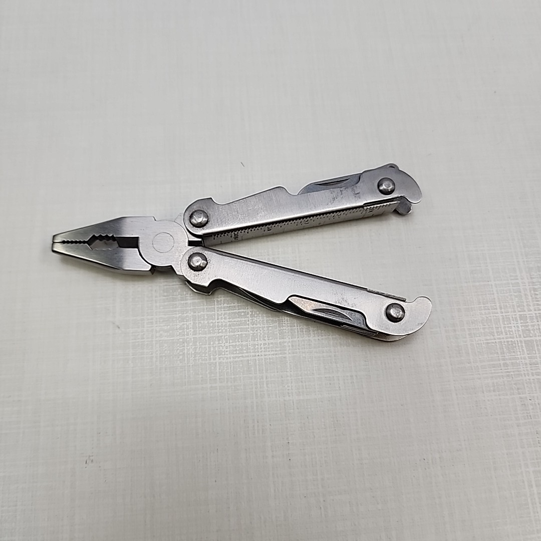 Pocket multi tool unbranded, plier, knife, file, screw drivers, awl, can opener