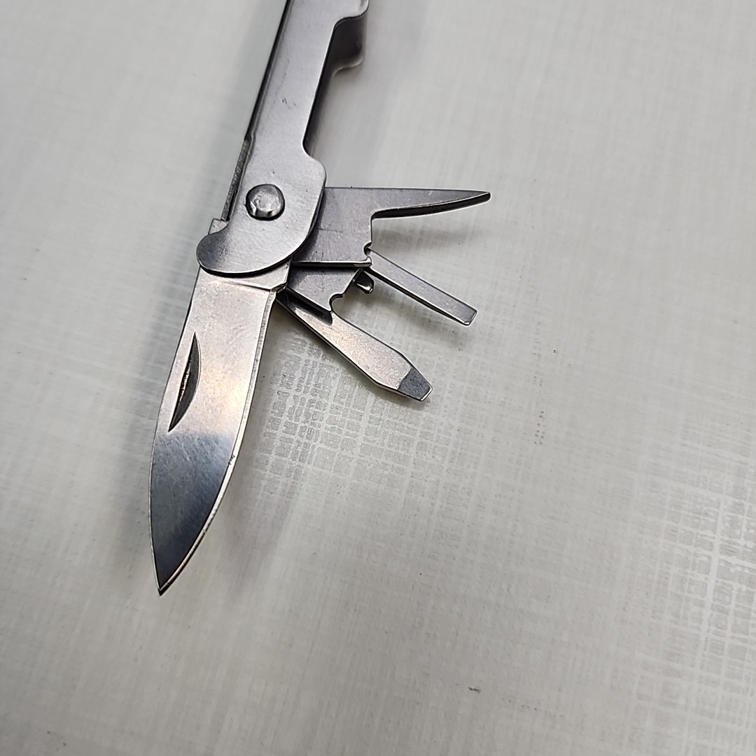 Pocket multi tool unbranded, plier, knife, file, screw drivers, awl, can opener