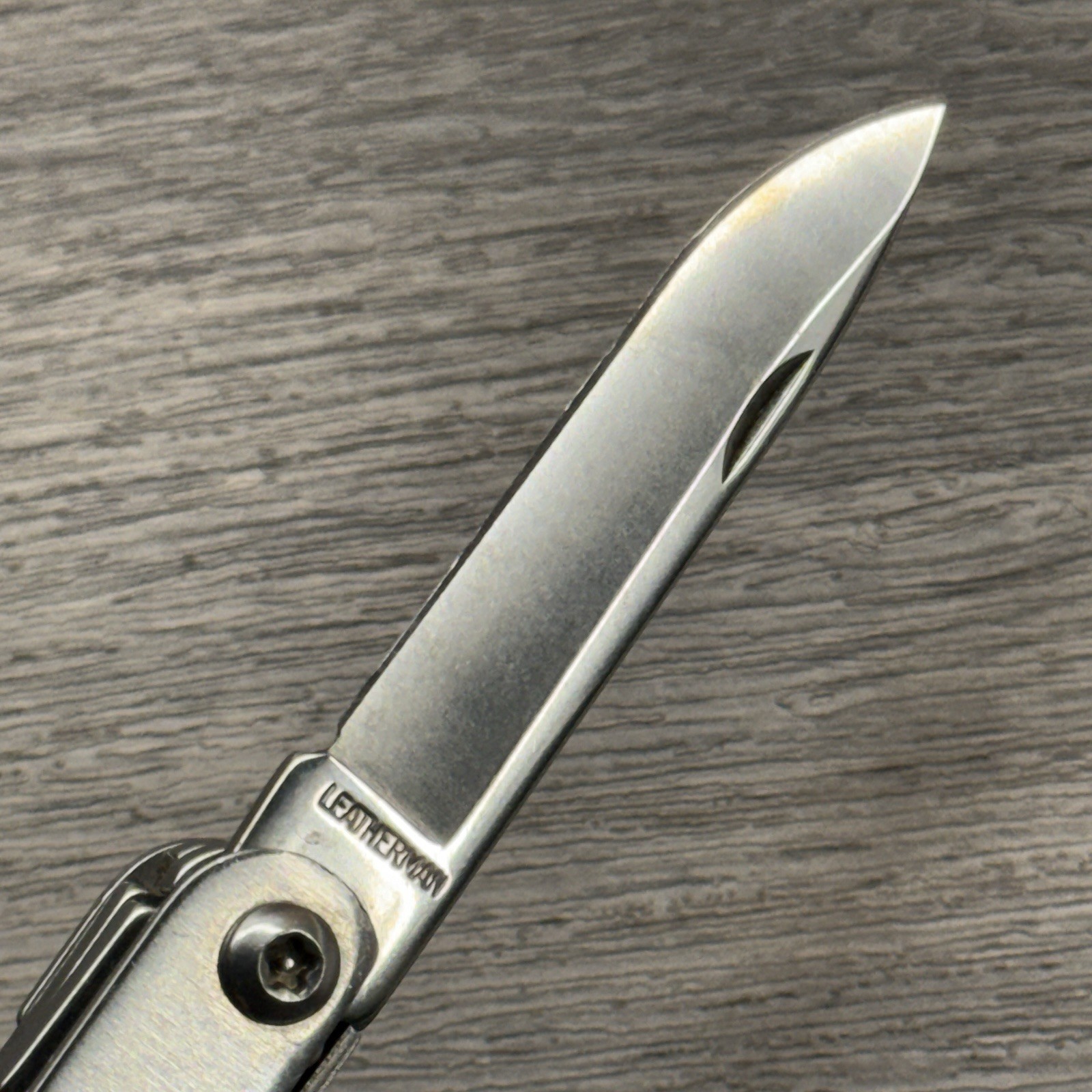Leatherman Sideclip multitool. Lightly used. Late Run: shiny factory polished