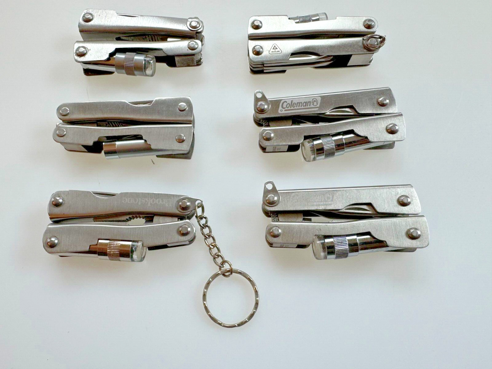 Lot of 6 Multi Tools (branded Coleman, etc.), Good Condition