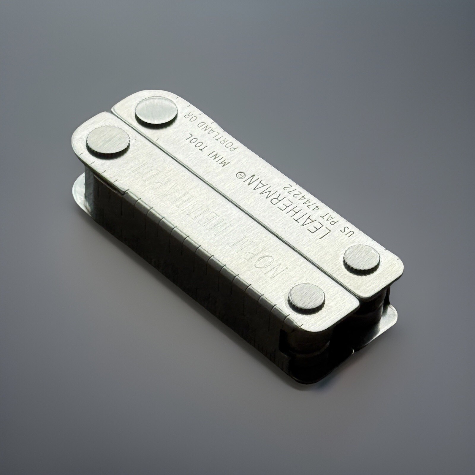 Leatherman MINI TOOL multitool. Variant w/US PAT 4744272 on Both Sides. Engraved