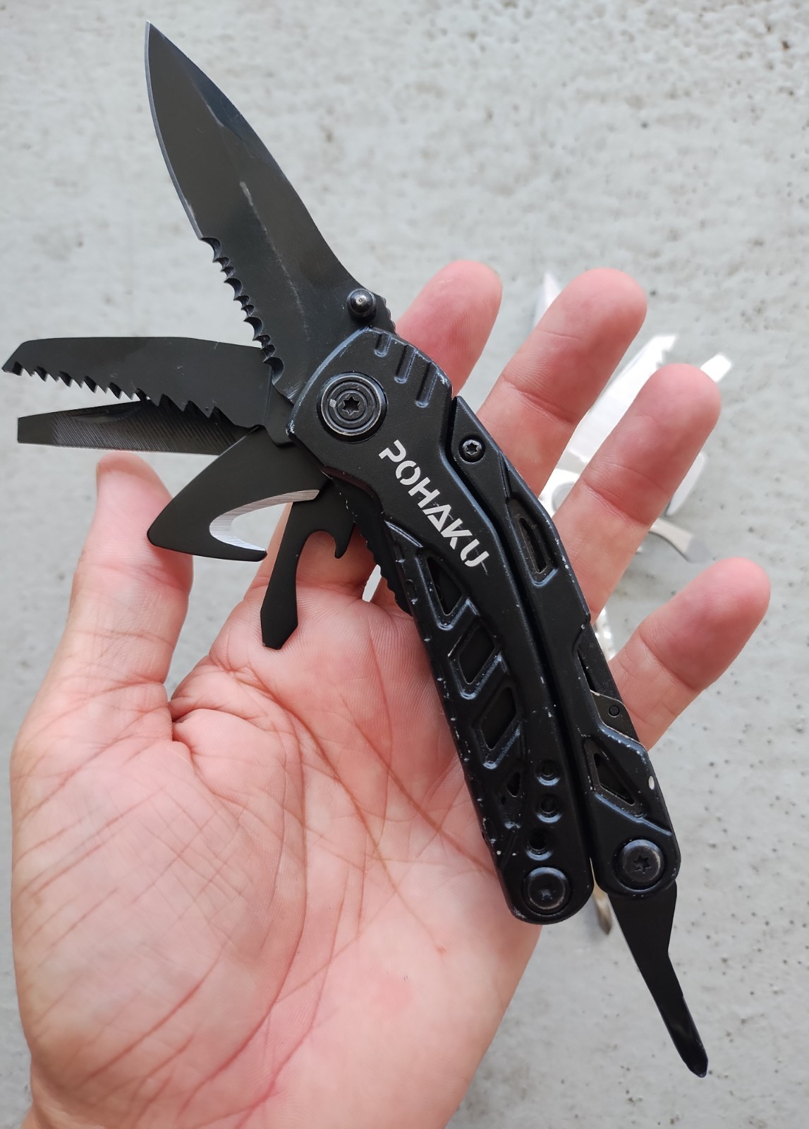 POHAKU BLACK & SILVER MULTI TOOL PLIERS KNIFE, SAW BLADE, FILE, ETC. LOT OF 2