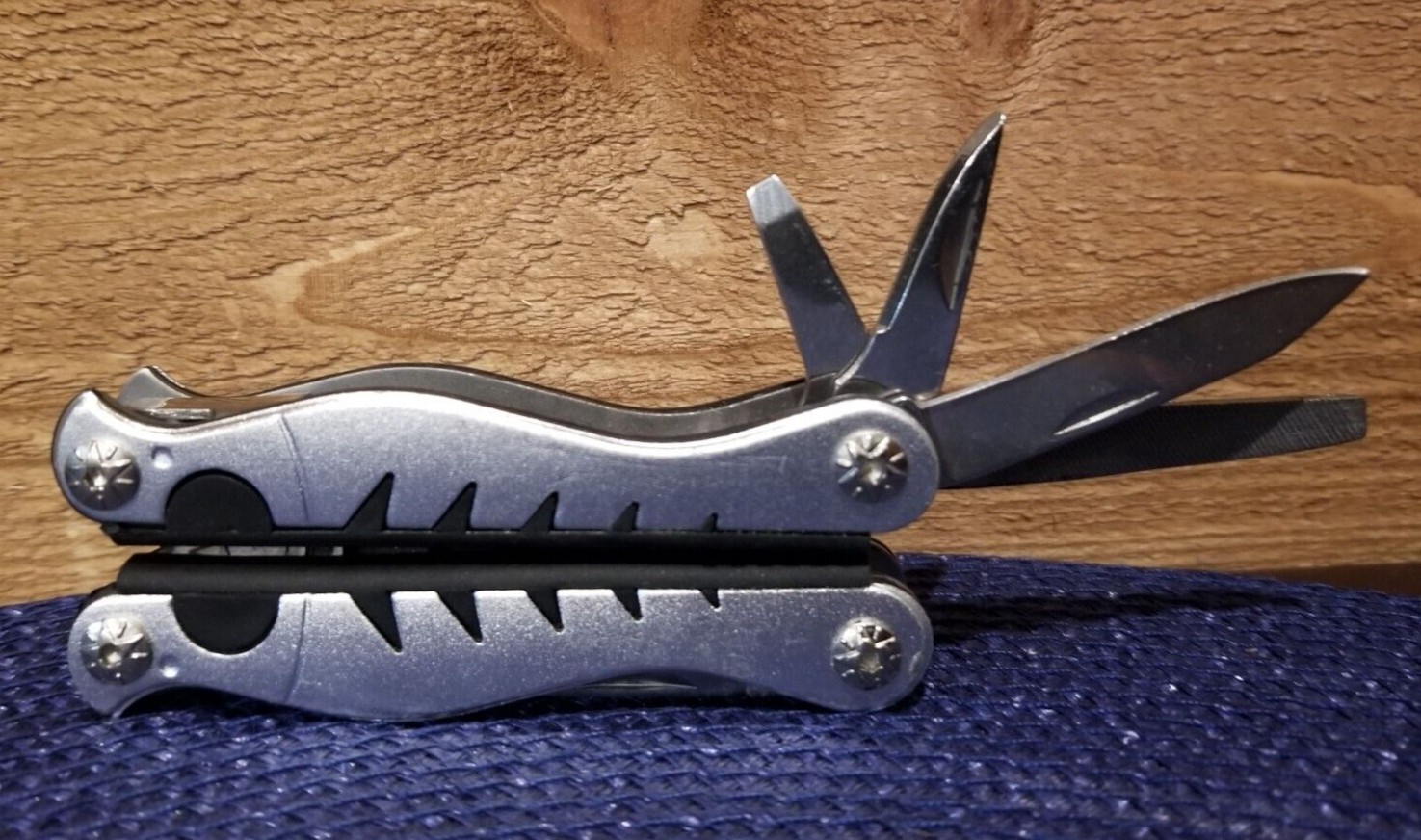 9-in-1 Stainless Steel Multi-Tool Pliers Knife Phillips File Serrated Blade