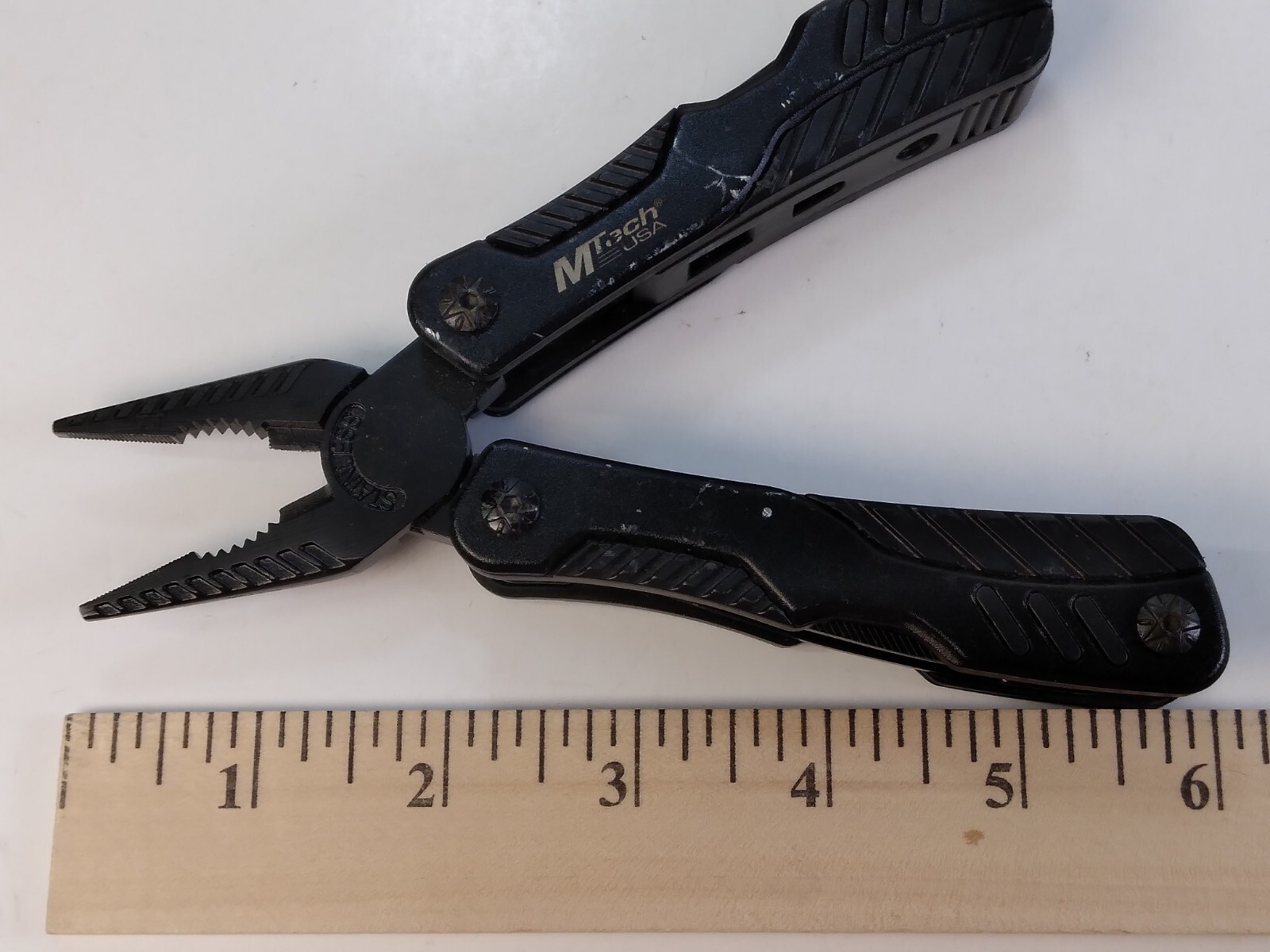 MTech 6″ Black Multi-Tool Needle Nose Pliers Cutters Plus Eight Tools Stainless