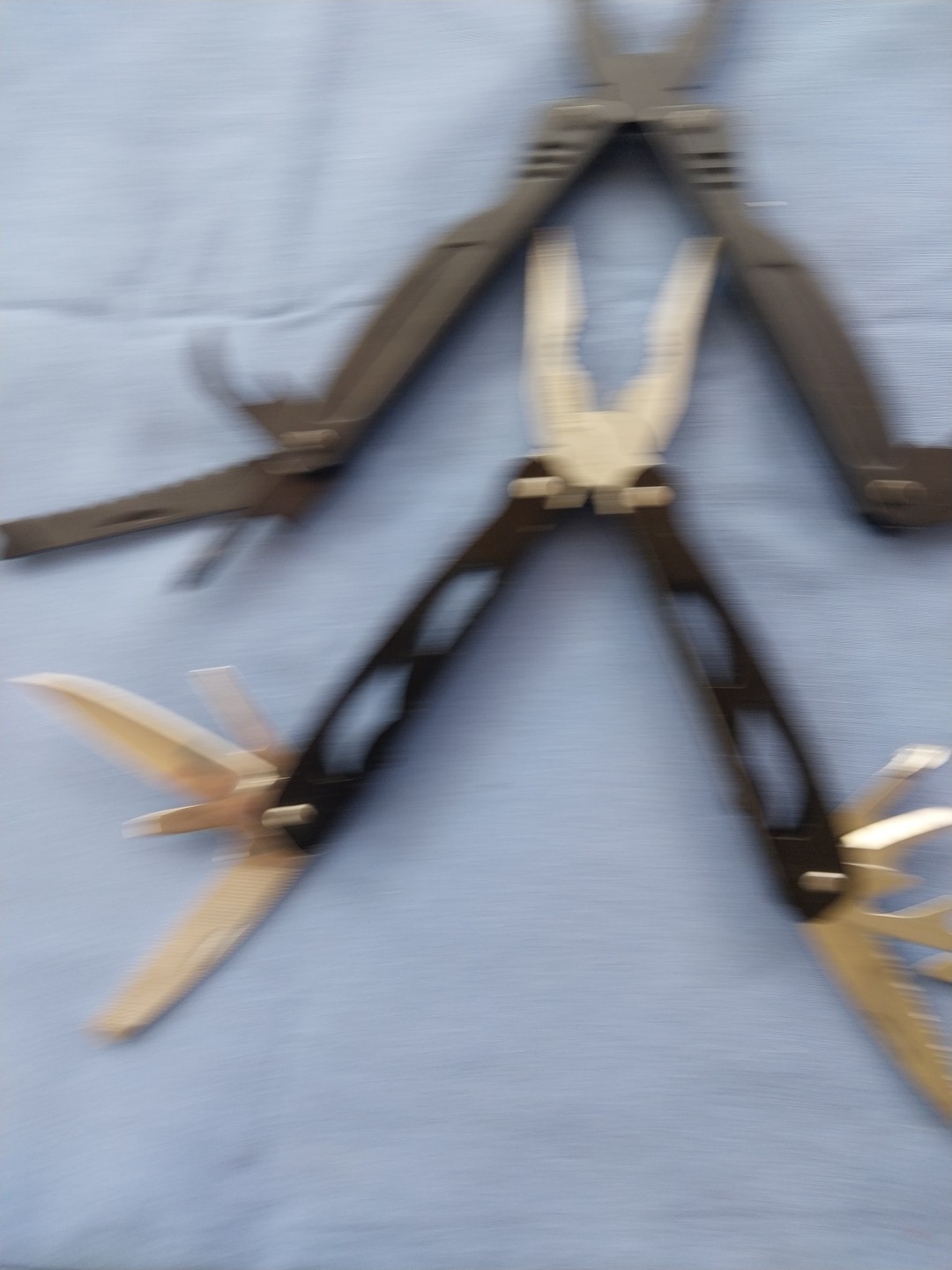 4 multi tools with pliers knives screwdrivers saw