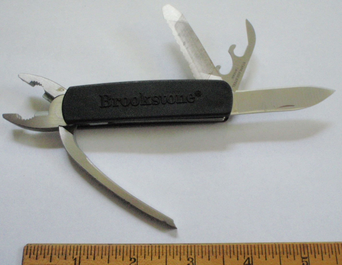 Brookstone Multi-Tool Stainless Steel Pliers wirecutter saw blade can opener