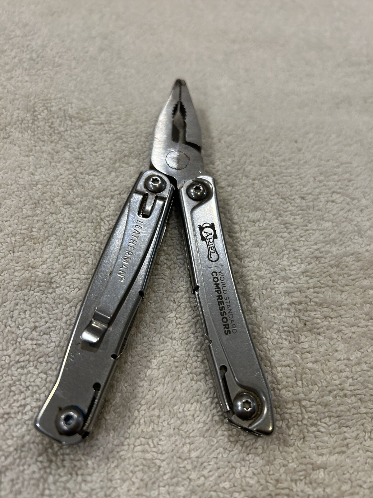 Leatherman Rev multitool with company logo