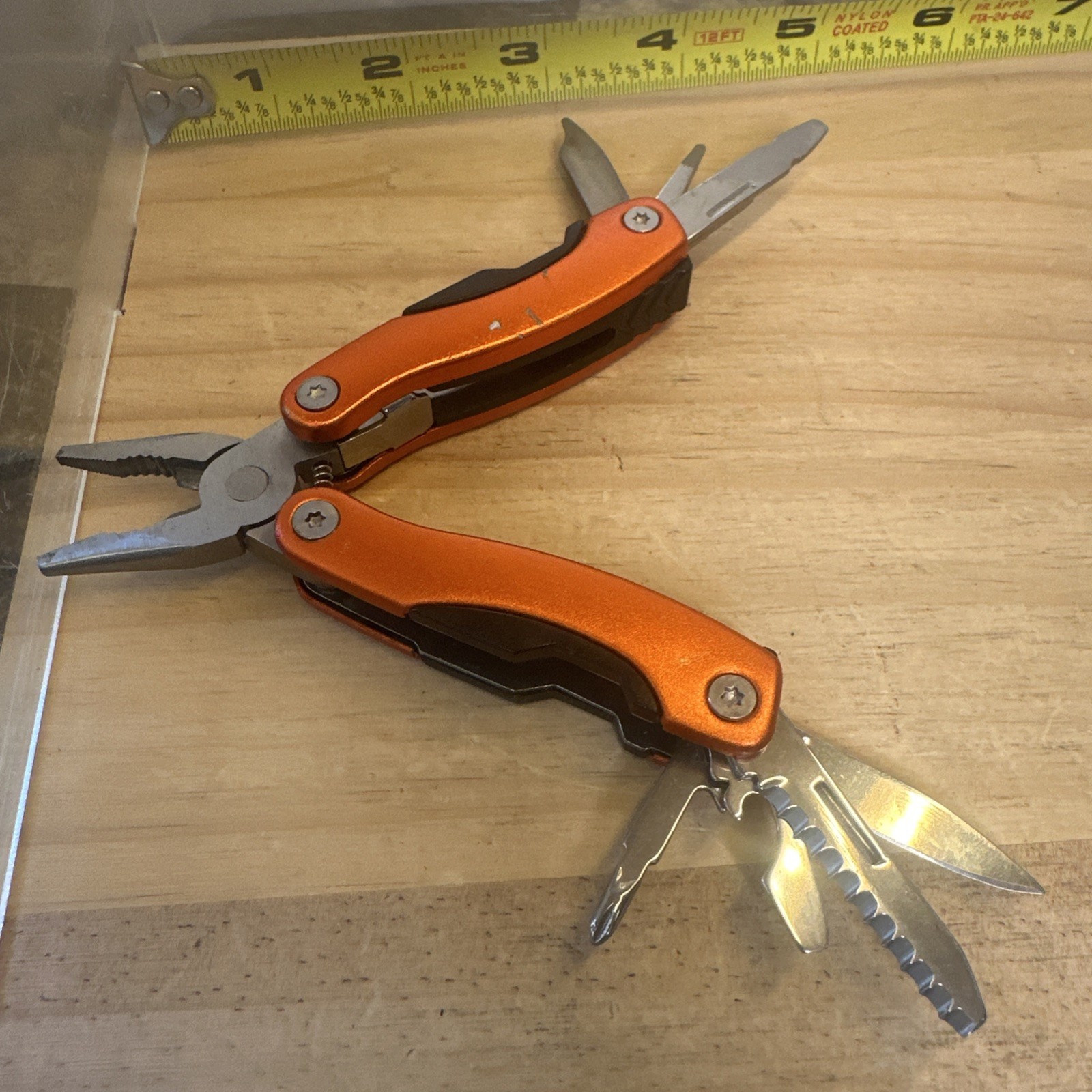 portable pocket multi-tool featuring spring-action pliers 2.75” Closed