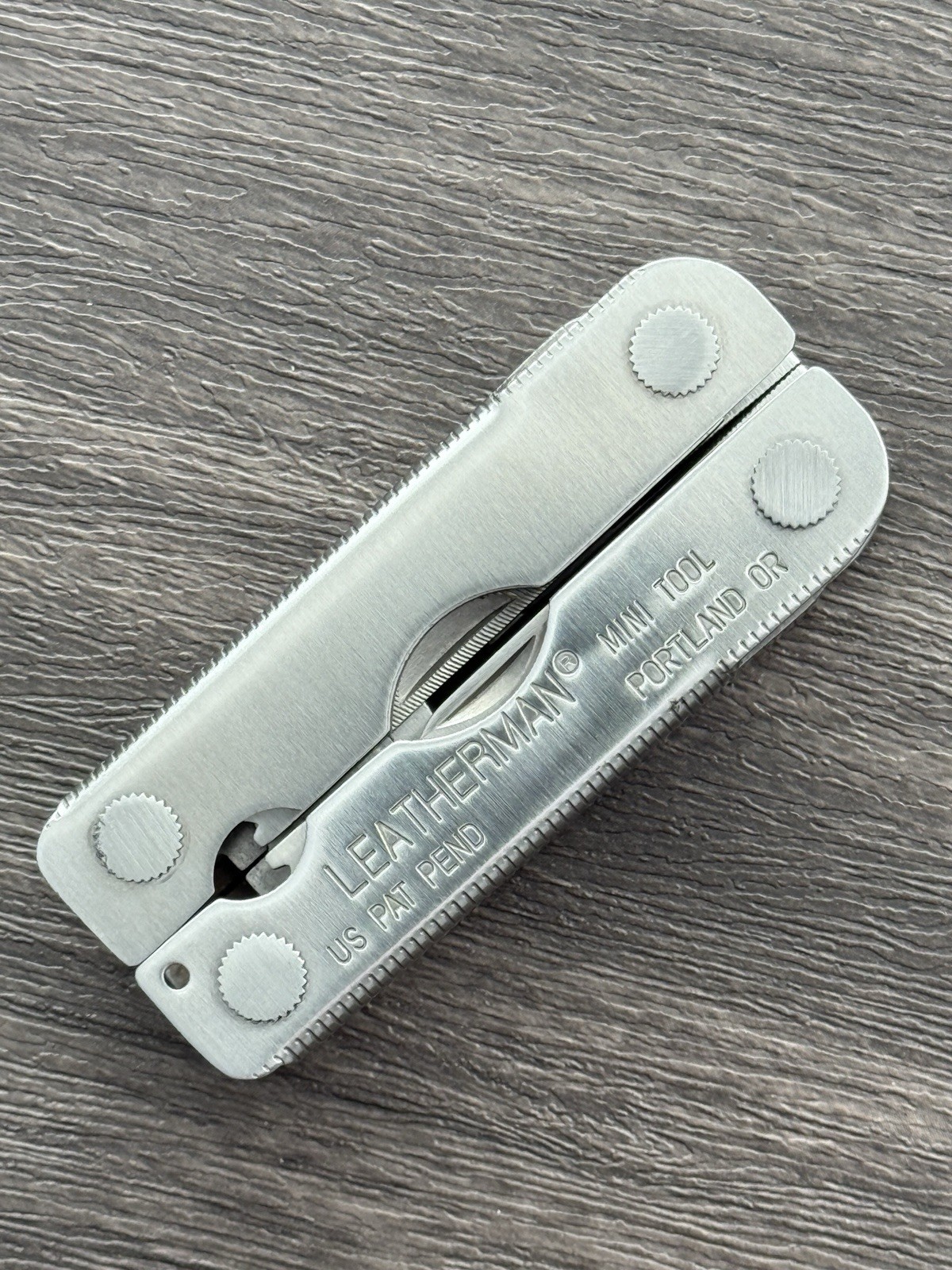 Leatherman MINI TOOL multitool. US PAT PEND w/Pliers Precision Alignment Hole!