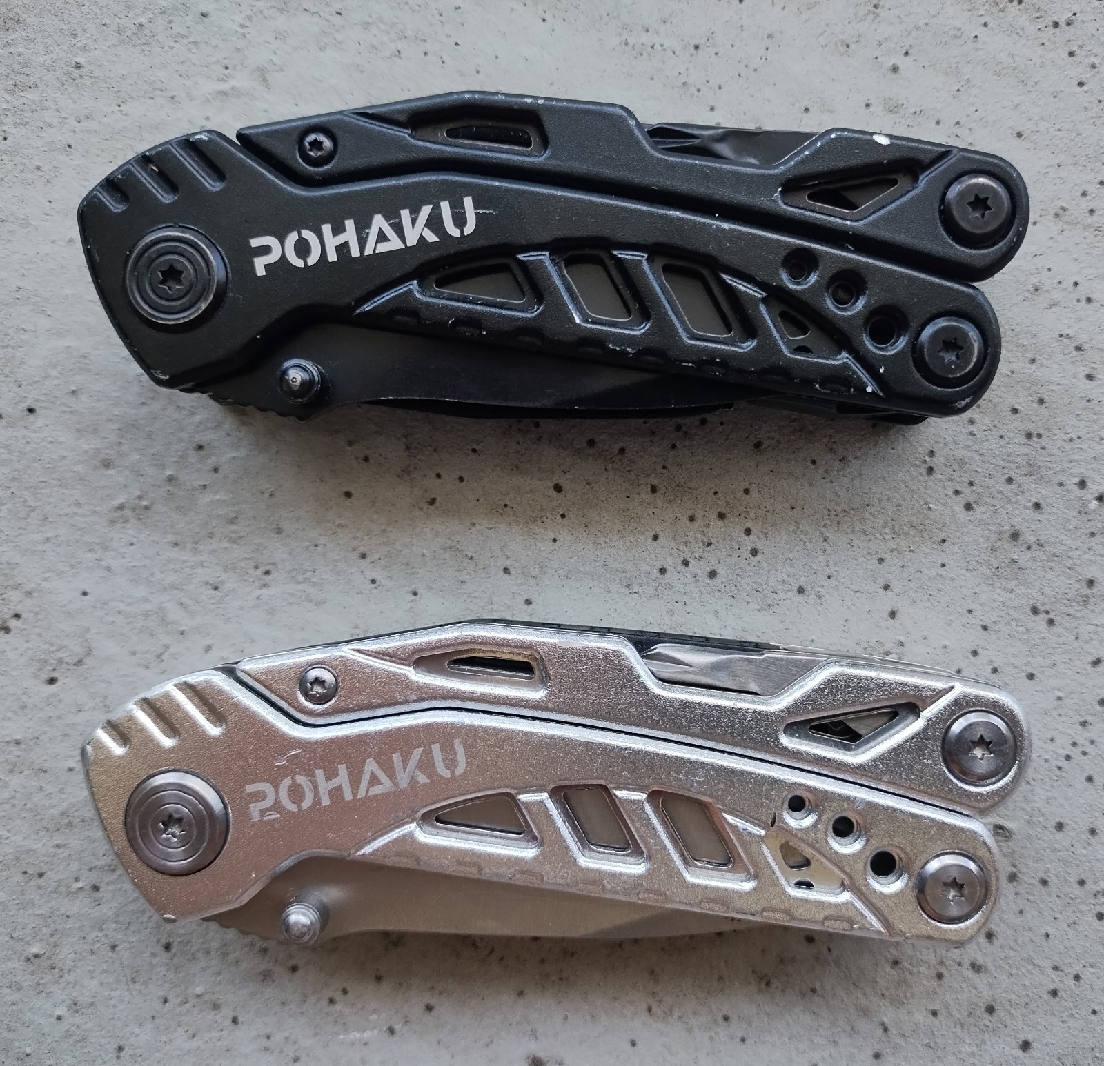 POHAKU BLACK & SILVER MULTI TOOL PLIERS KNIFE, SAW BLADE, FILE, ETC. LOT OF 2