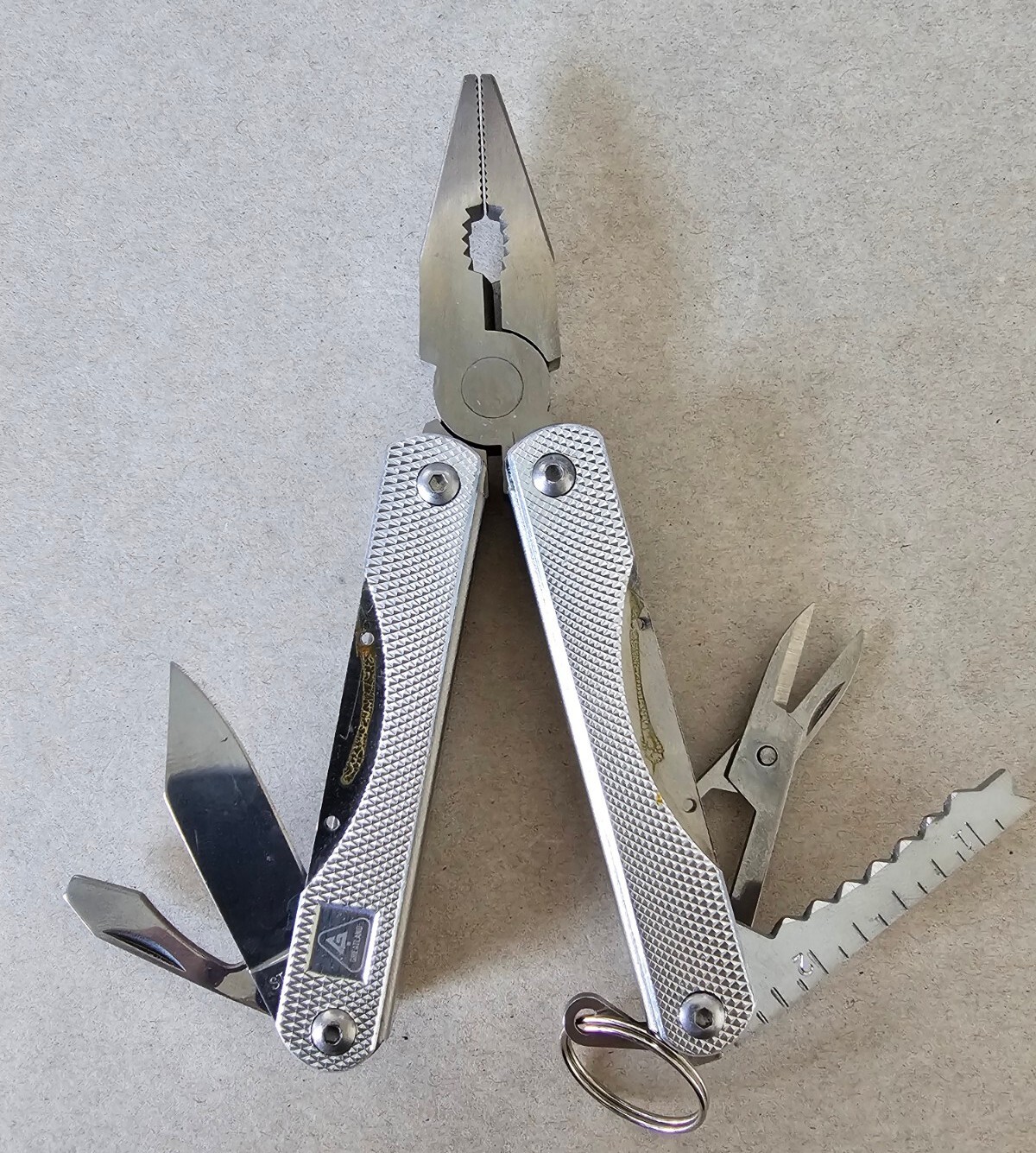 Pocket Multi-Tool with 9 Tools – Pliers Cutters Opener Flat Head Scissors Knife