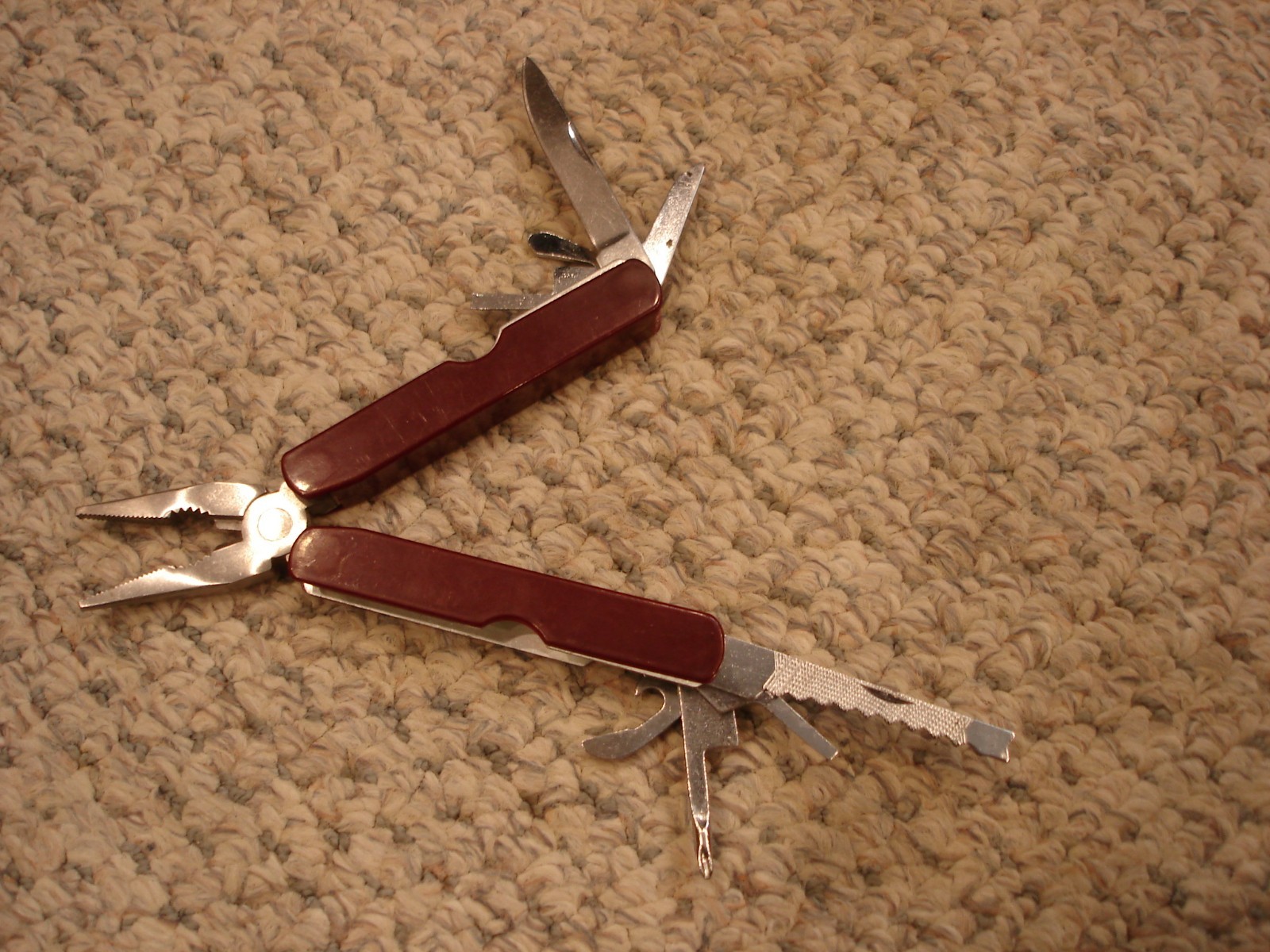 Leatherman vintage multi tool dark red handle 9 tools in one