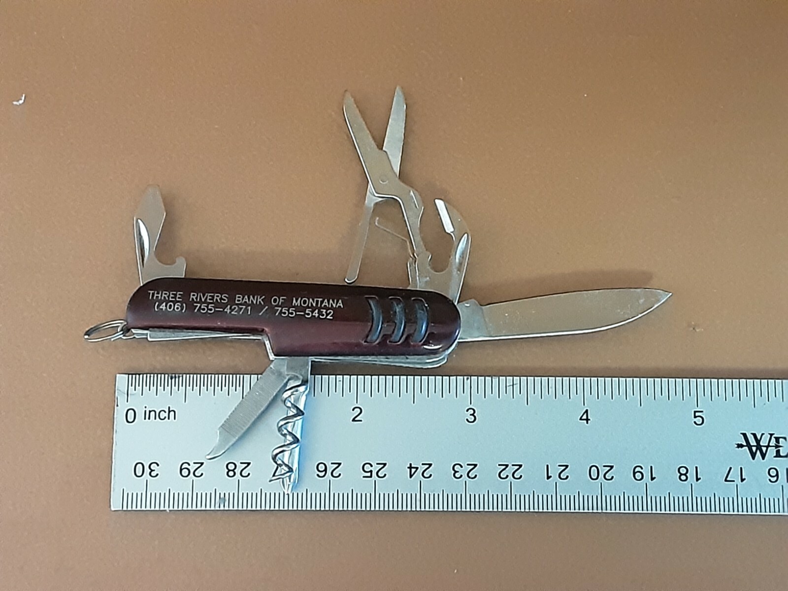 Small multi tool knife, bottle Opener, can opener, cork screw, phillips, file