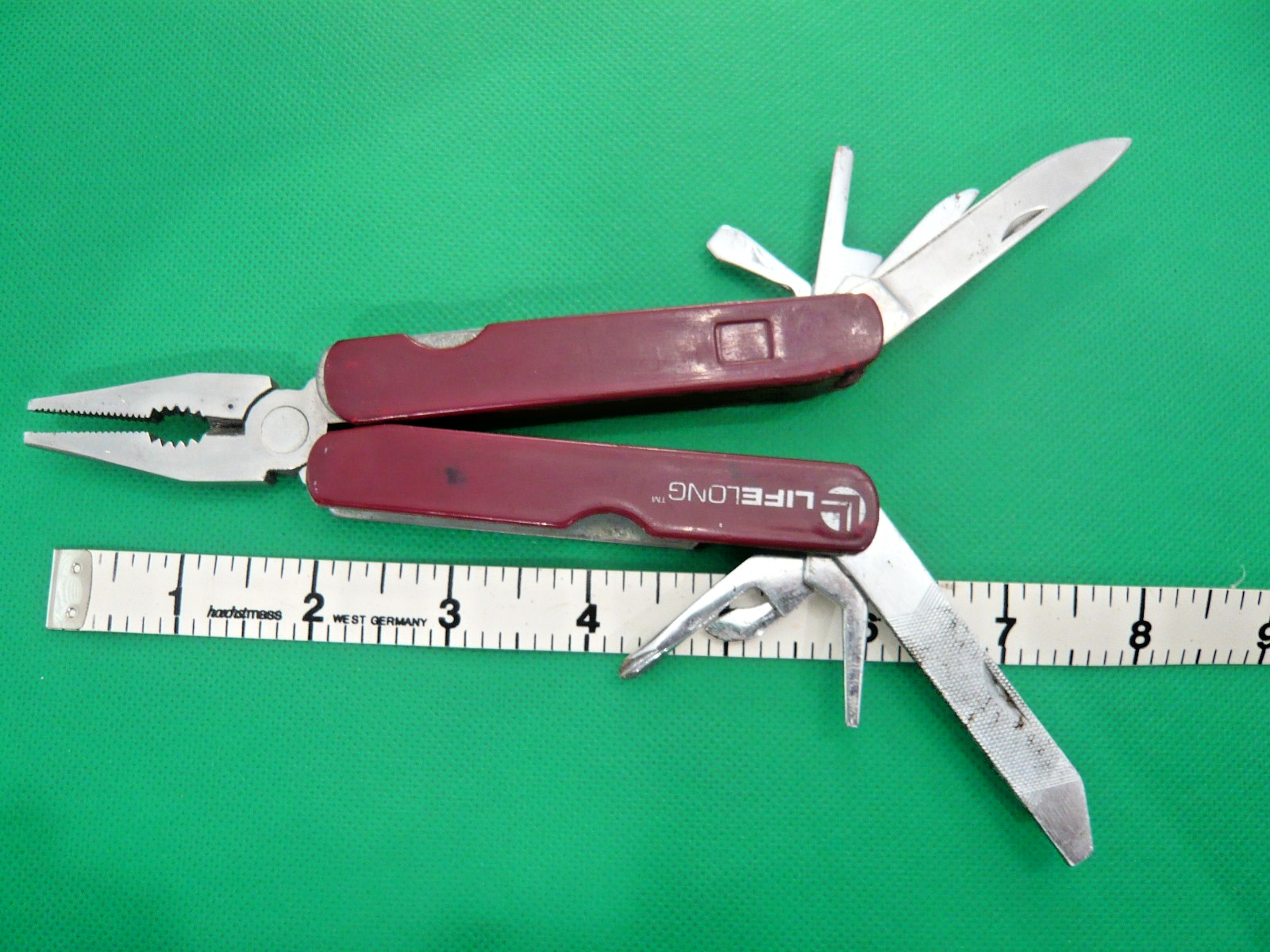 Lifelong Multi Tool 9 Tools in One. Stainless Pliers, knives, tools.