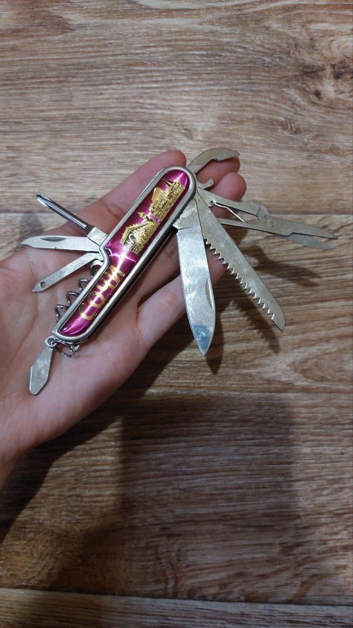 Tourist multitool knife 10 in 1, knife, corkscrew, screwdriver, scissors. Sochi