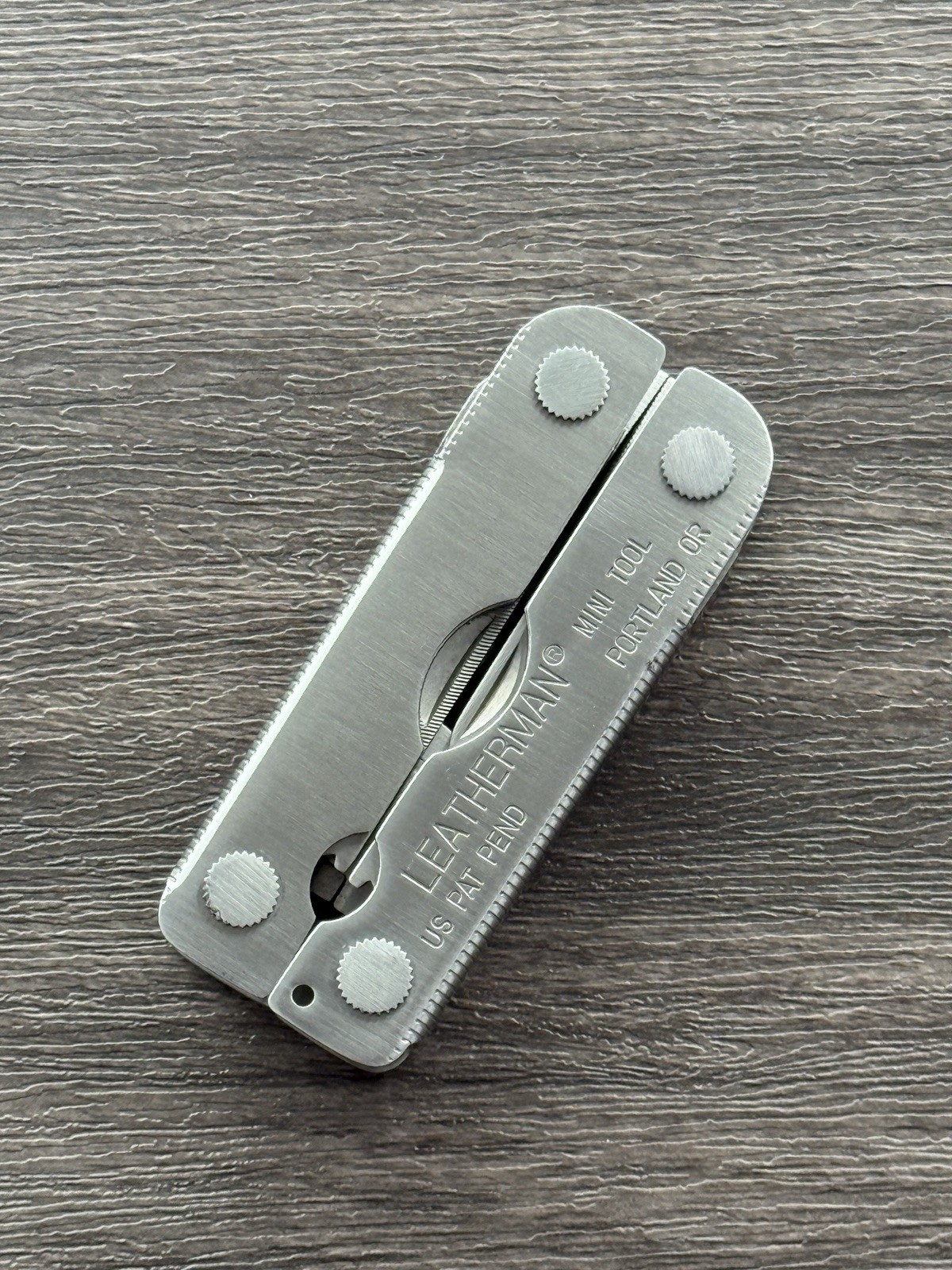 Leatherman MINI TOOL multitool. US PAT PEND w/Pliers Precision Alignment Hole!