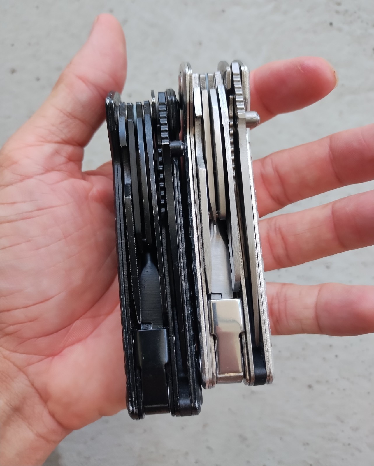 POHAKU BLACK & SILVER MULTI TOOL PLIERS KNIFE, SAW BLADE, FILE, ETC. LOT OF 2