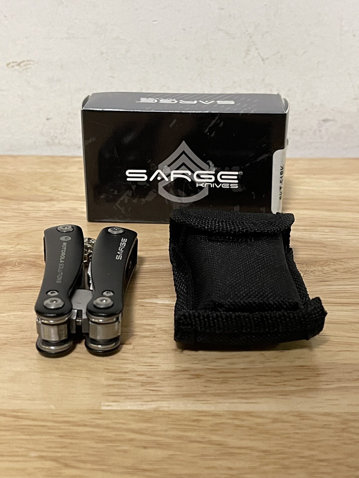 Sarge Mini 10 In 1 Black Zytel Stainless Steel Multi Tool Company Logo