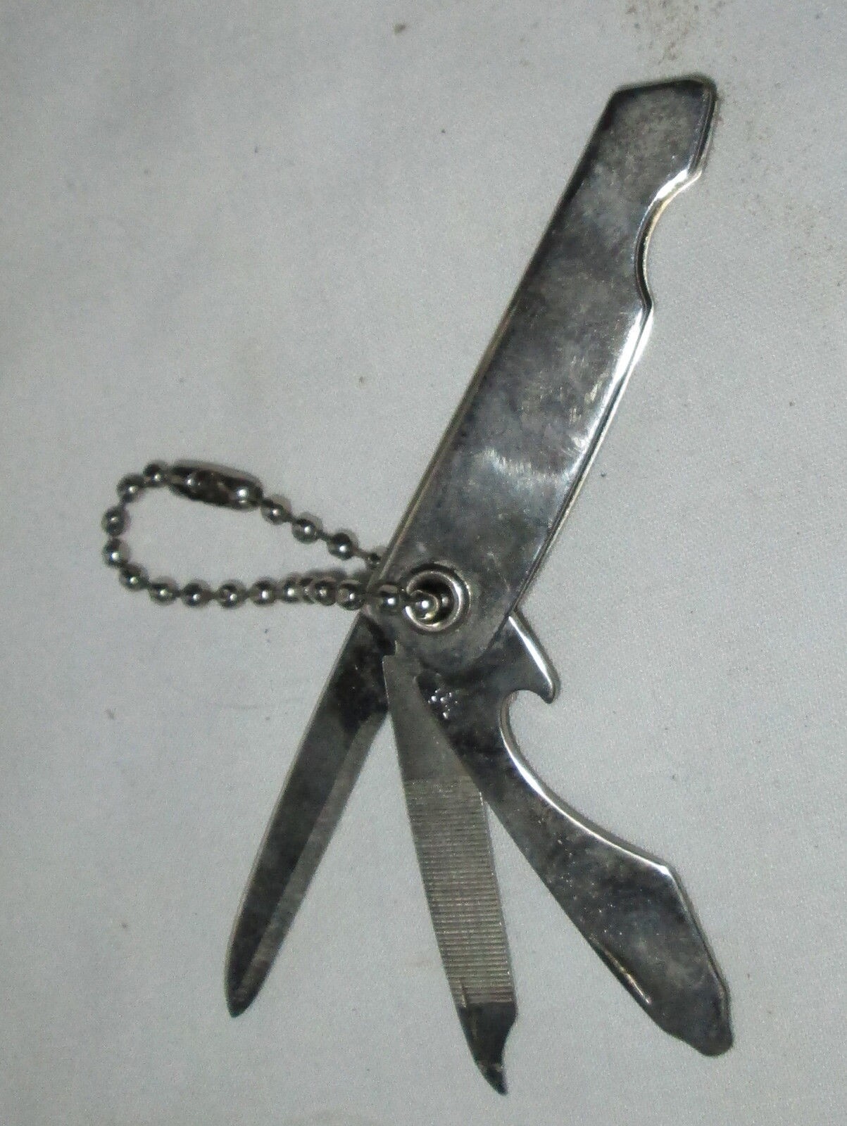 USED METAL KEYCHAIN BOTTLE OPENER KNIFE AND FILE