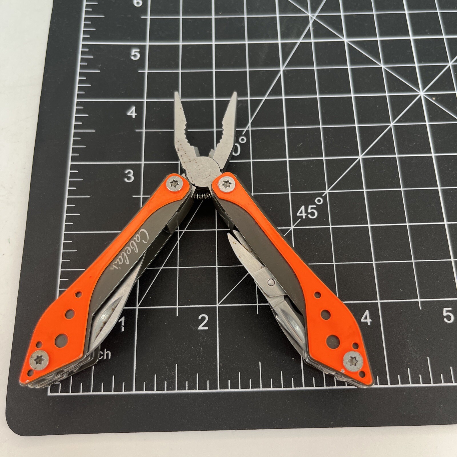 LOT OF 2 Cabela’s SILVER & ORANGE Mini MultiTool Spring Open Pliers Scissors Saw