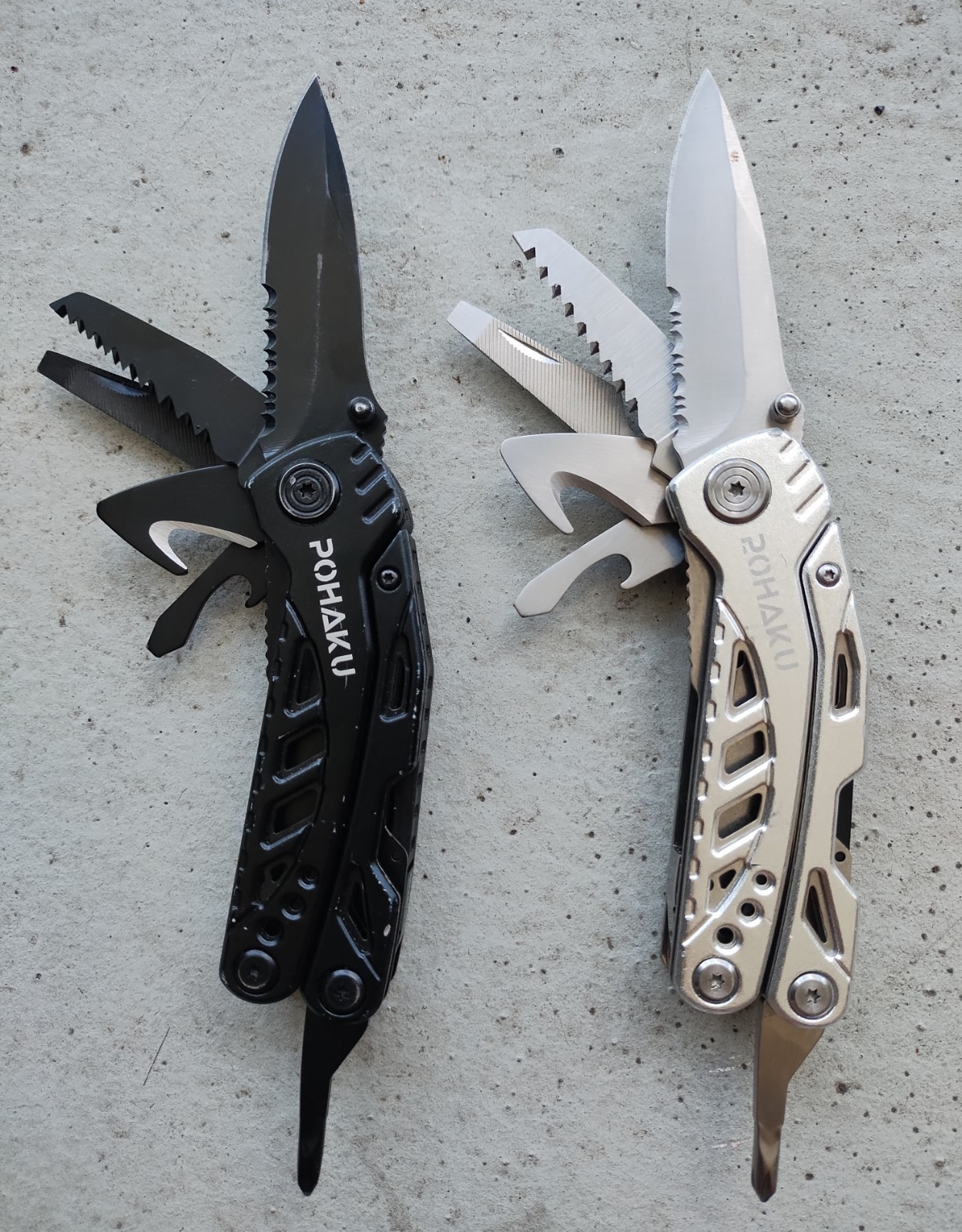 POHAKU BLACK & SILVER MULTI TOOL PLIERS KNIFE, SAW BLADE, FILE, ETC. LOT OF 2