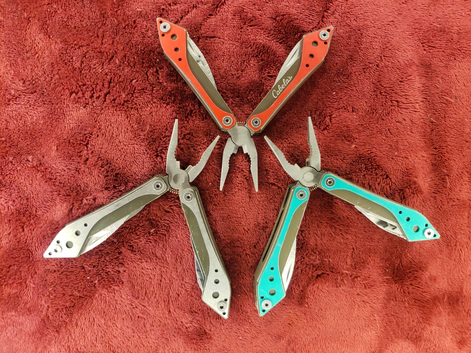 Lot of three Cabela’s Multi Tool Stainless Clear, Teal Green & Red