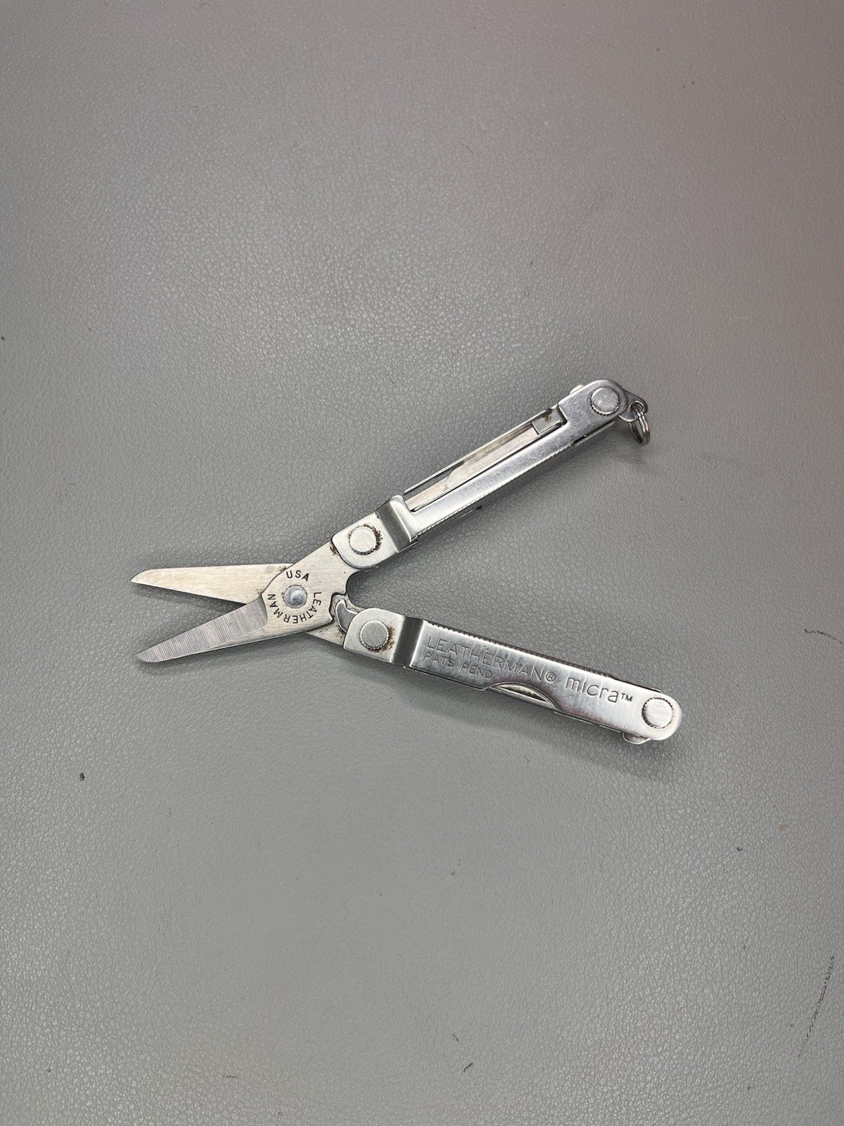 Leatherman Micra keychain multi-tool with sheath. USA
