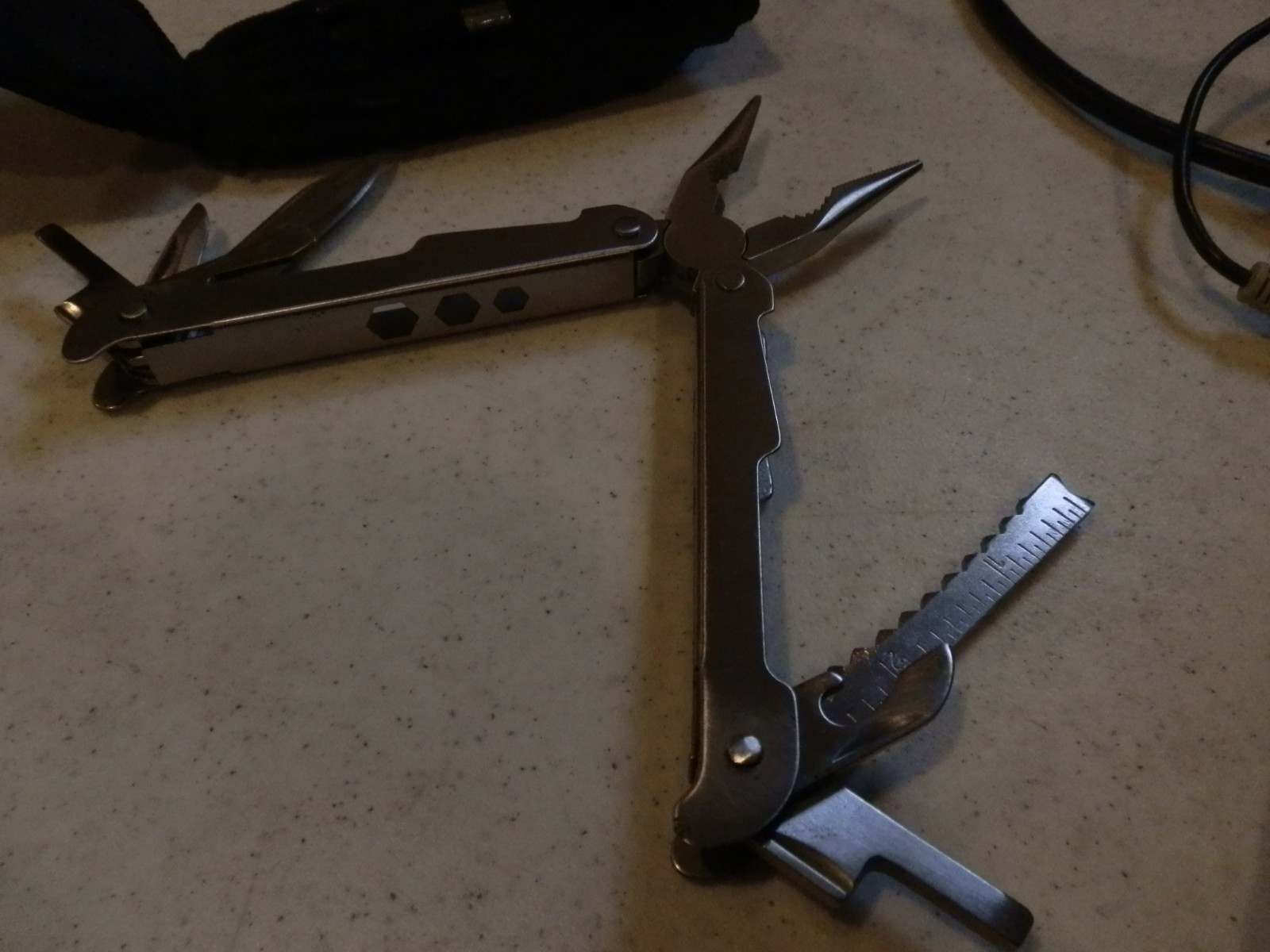 Multitool. Unbranded. Nylon sheath. 8 auxilliary bits – see photos. EUC