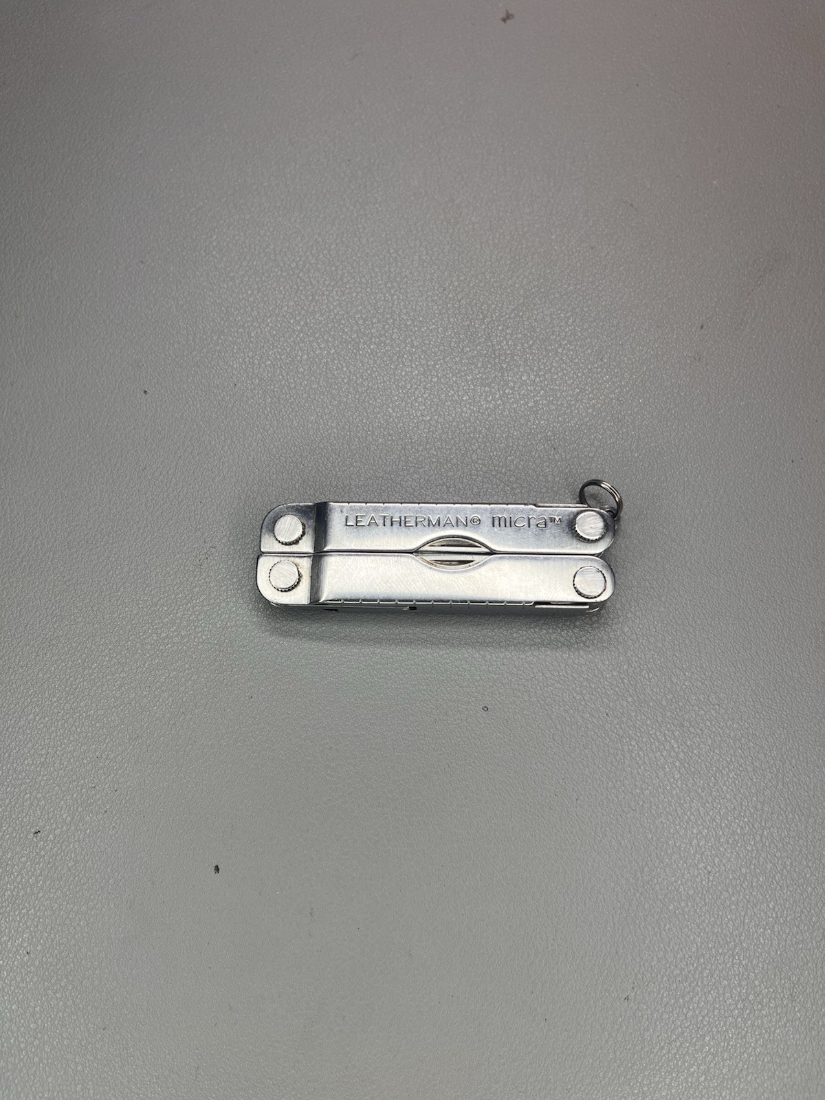 Leatherman Micra keychain multi-tool with sheath. USA