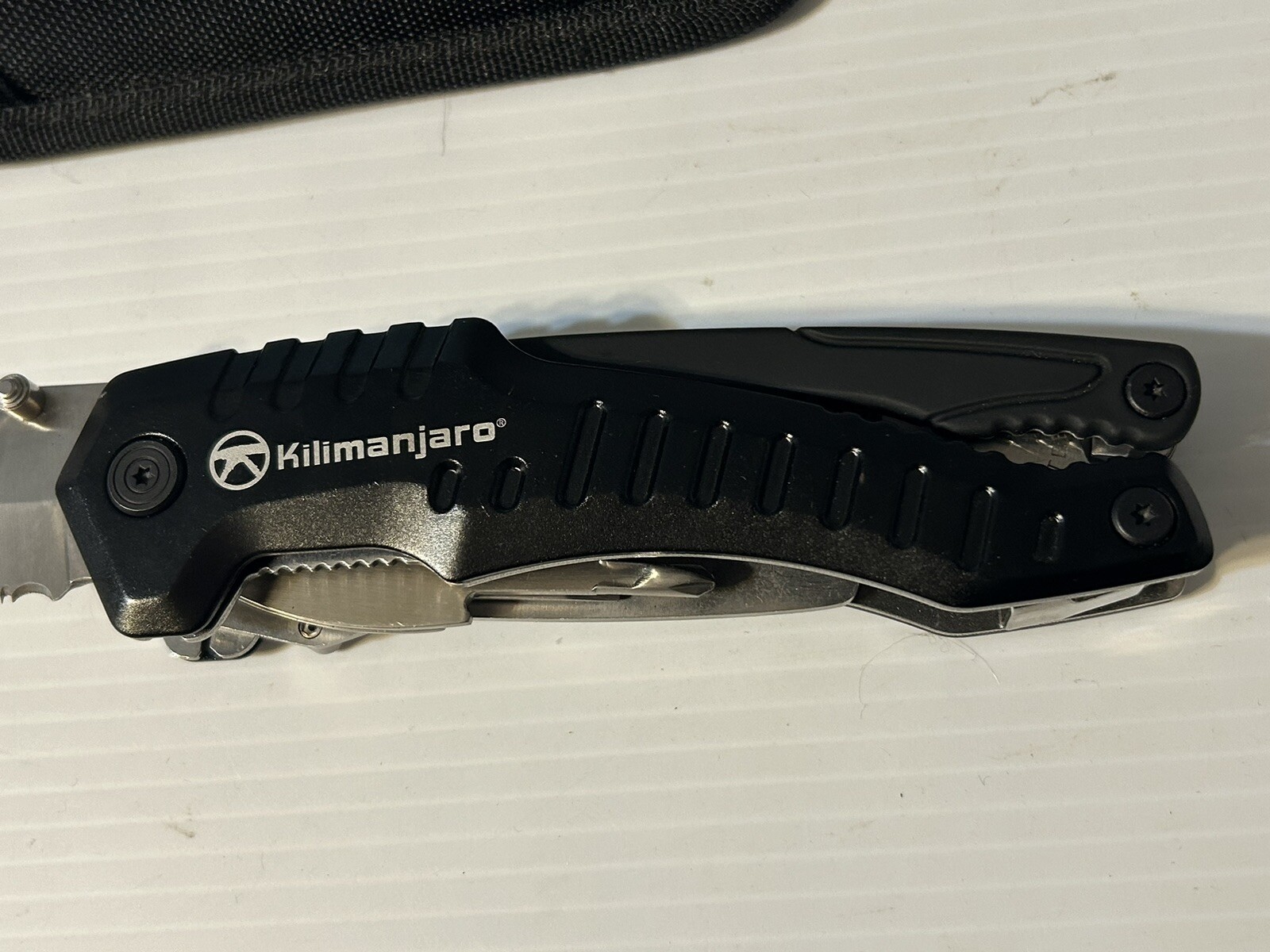 Kilimanjaro Magnus 9-in-1 XL Multi-Tool Folding with Snap Pouch New Never Used.