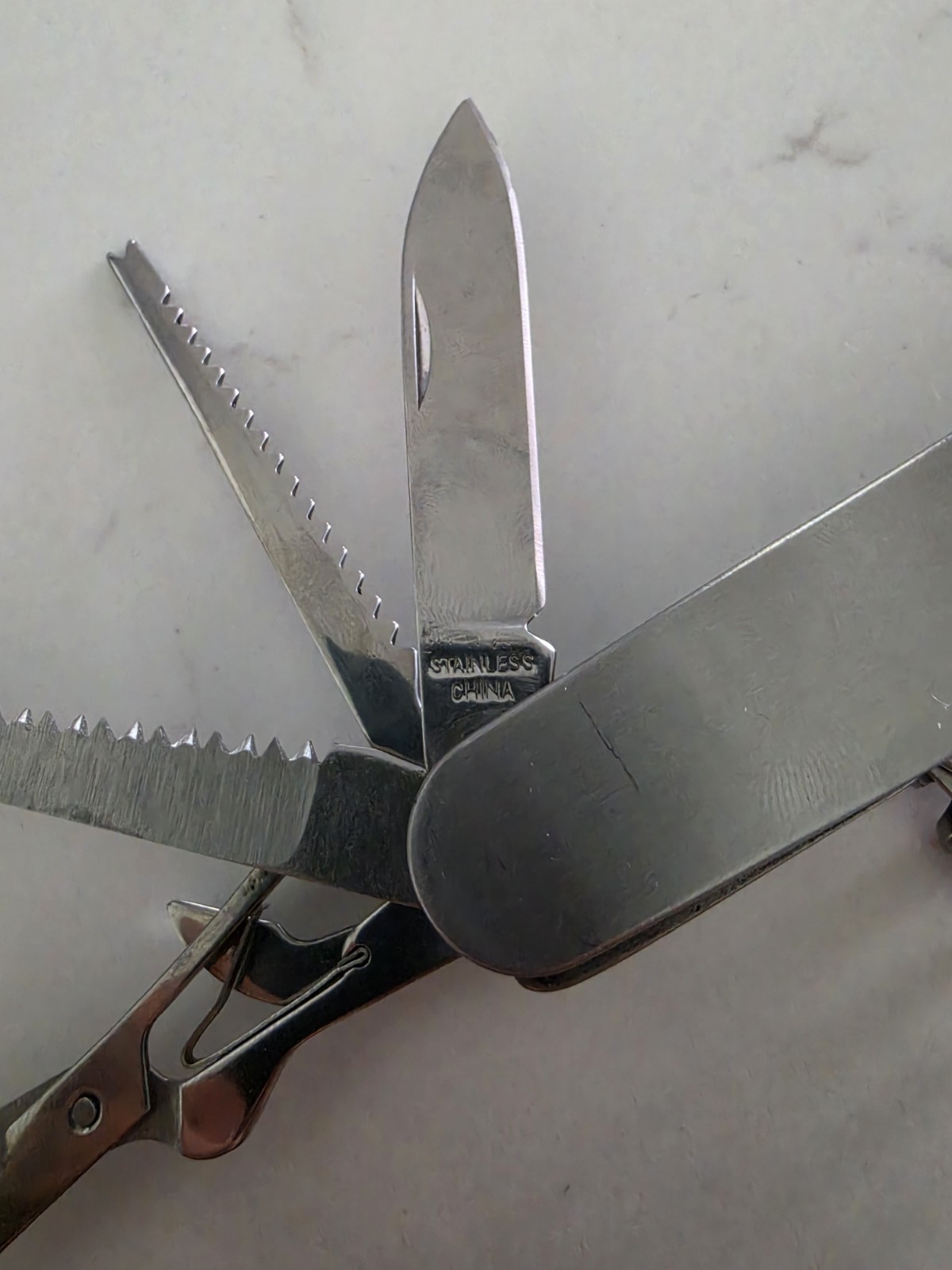 Mueller Co. Stainless Steel 12-in-1 Multi-Tool Knife Saw Scissors 2″ Blade