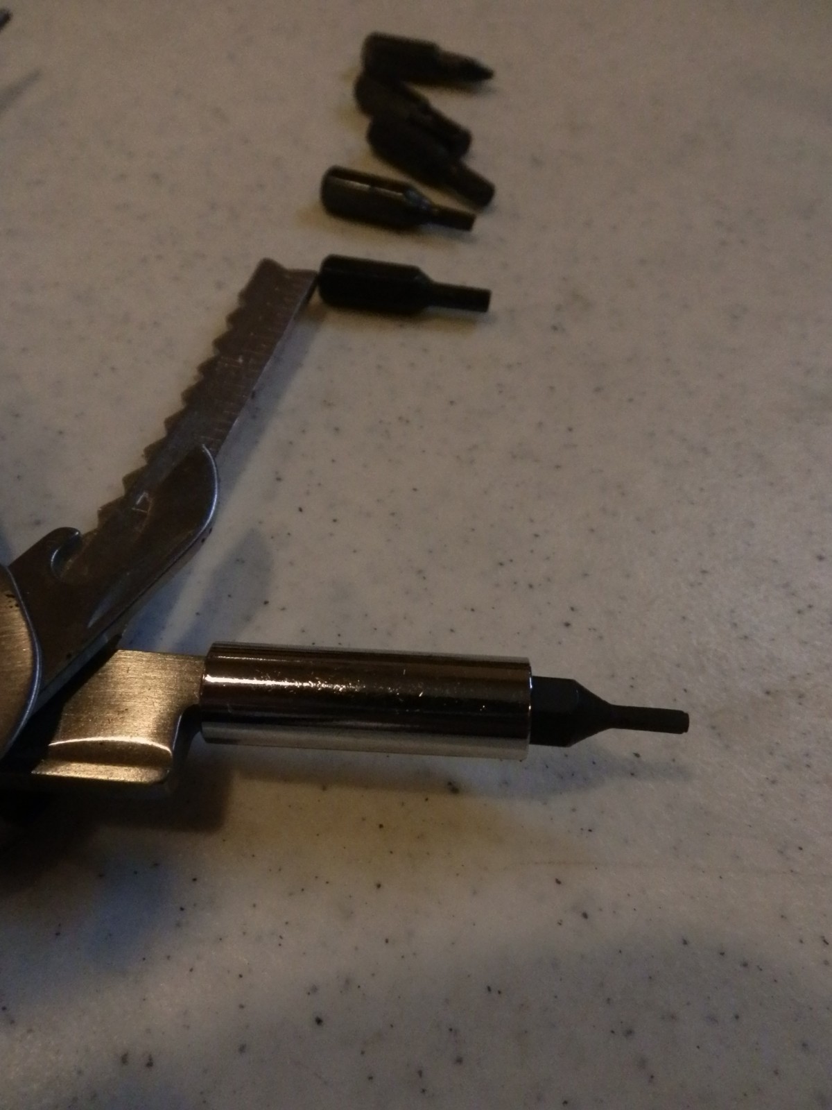 Multitool. Unbranded. Nylon sheath. 8 auxilliary bits – see photos. EUC
