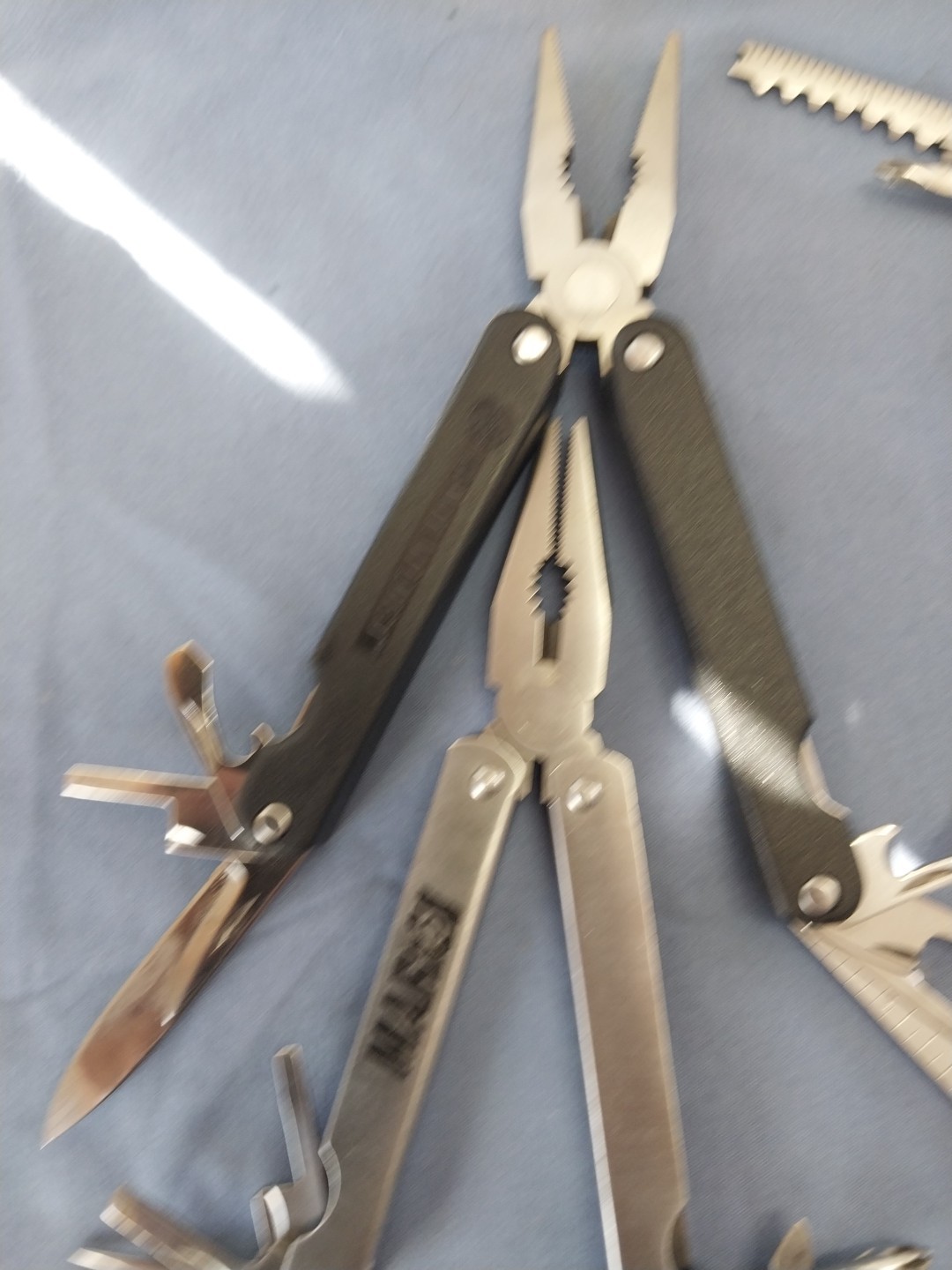 4 multi tools pliers screwdriver knife saw