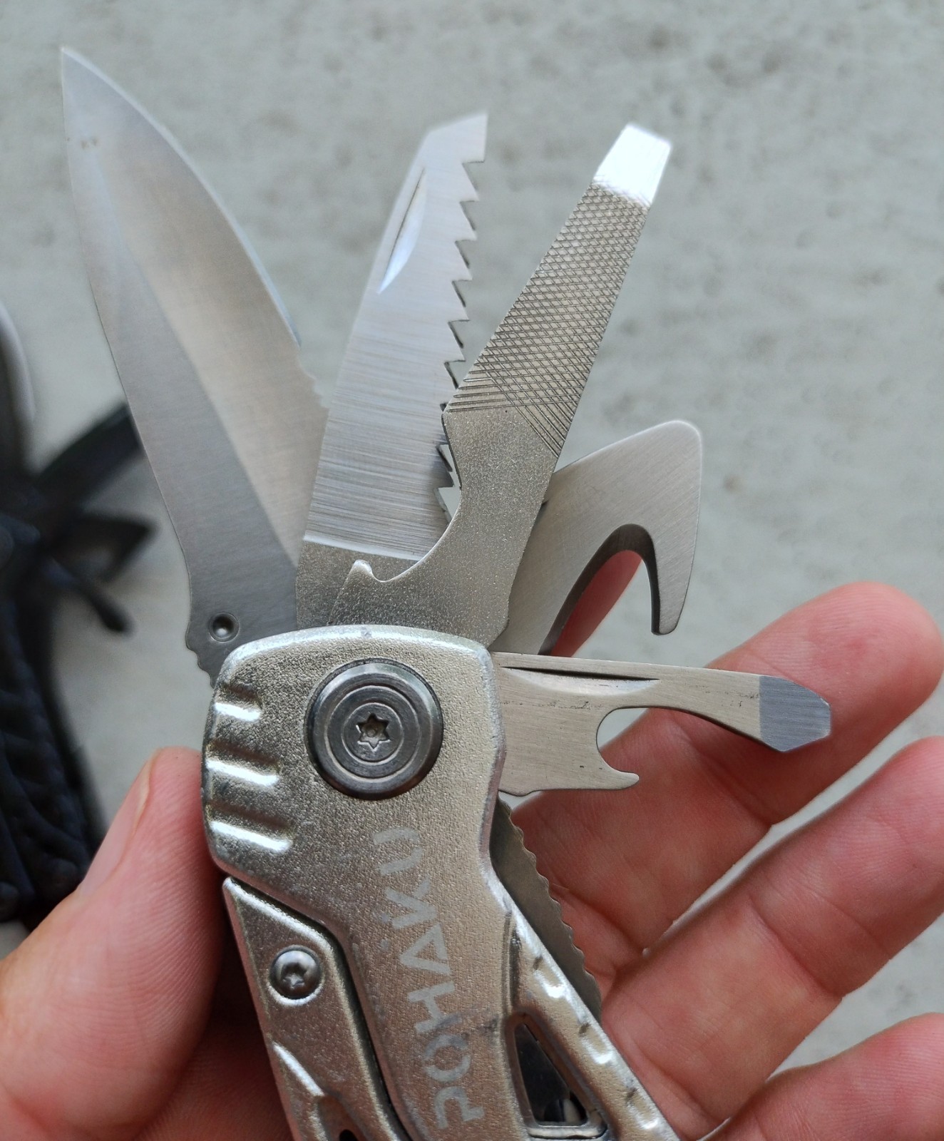 POHAKU BLACK & SILVER MULTI TOOL PLIERS KNIFE, SAW BLADE, FILE, ETC. LOT OF 2
