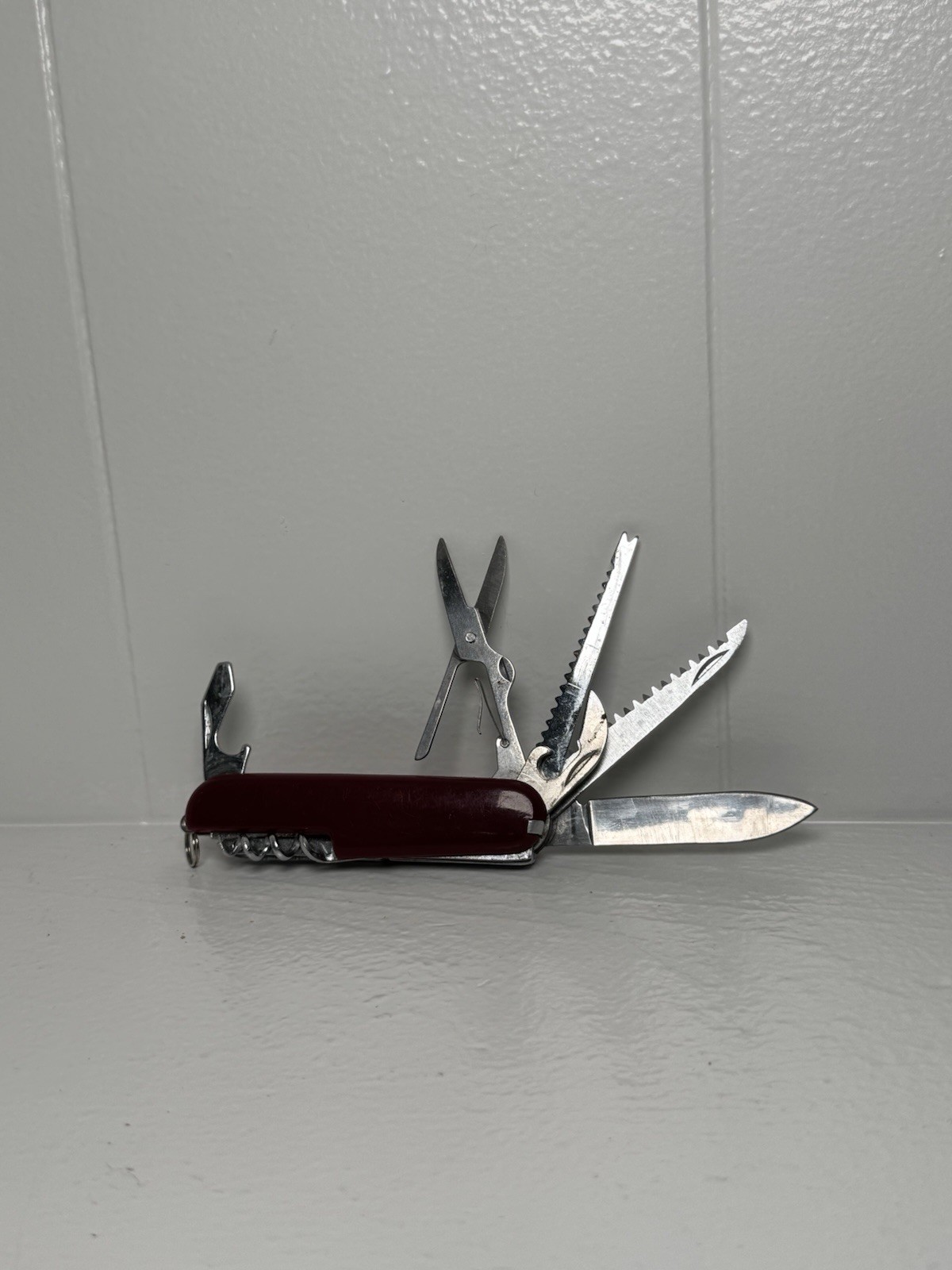 Red Swiss Army Knife With 12 Attachments Including Scissors, Saw, Etc