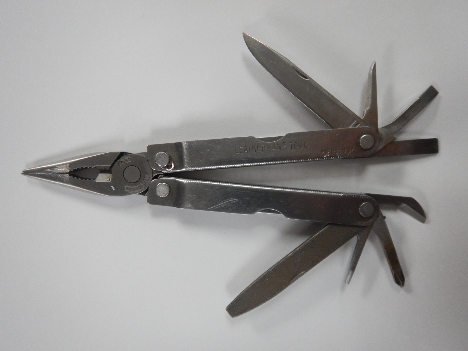 Vintage Leatherman Tool Stainless Steel Multi Tool Folding Knife made in 2002